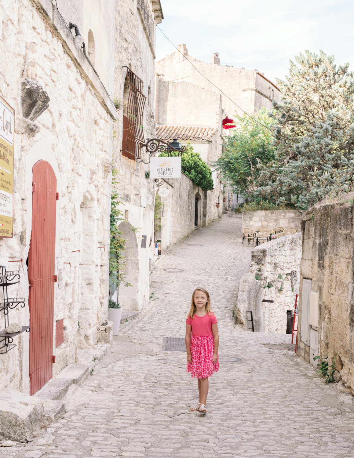 little girl in pink outfit in les baux de provence france