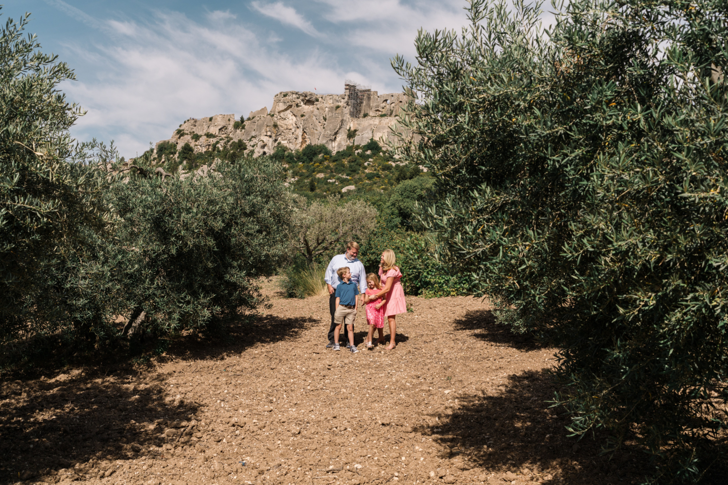 cute family has fun in olive grove in les baux de provence france