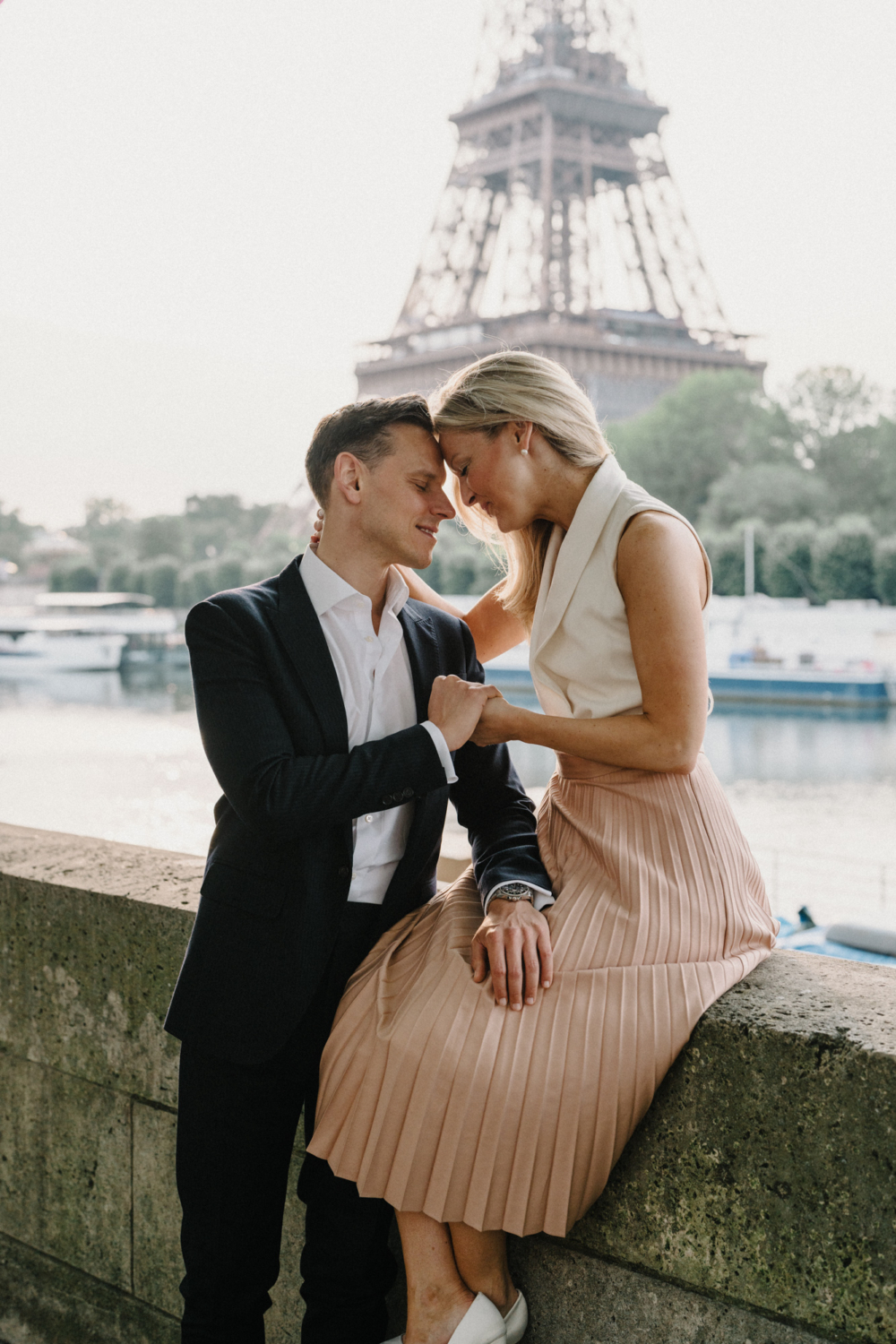 engaged couple put their heads together in paris
