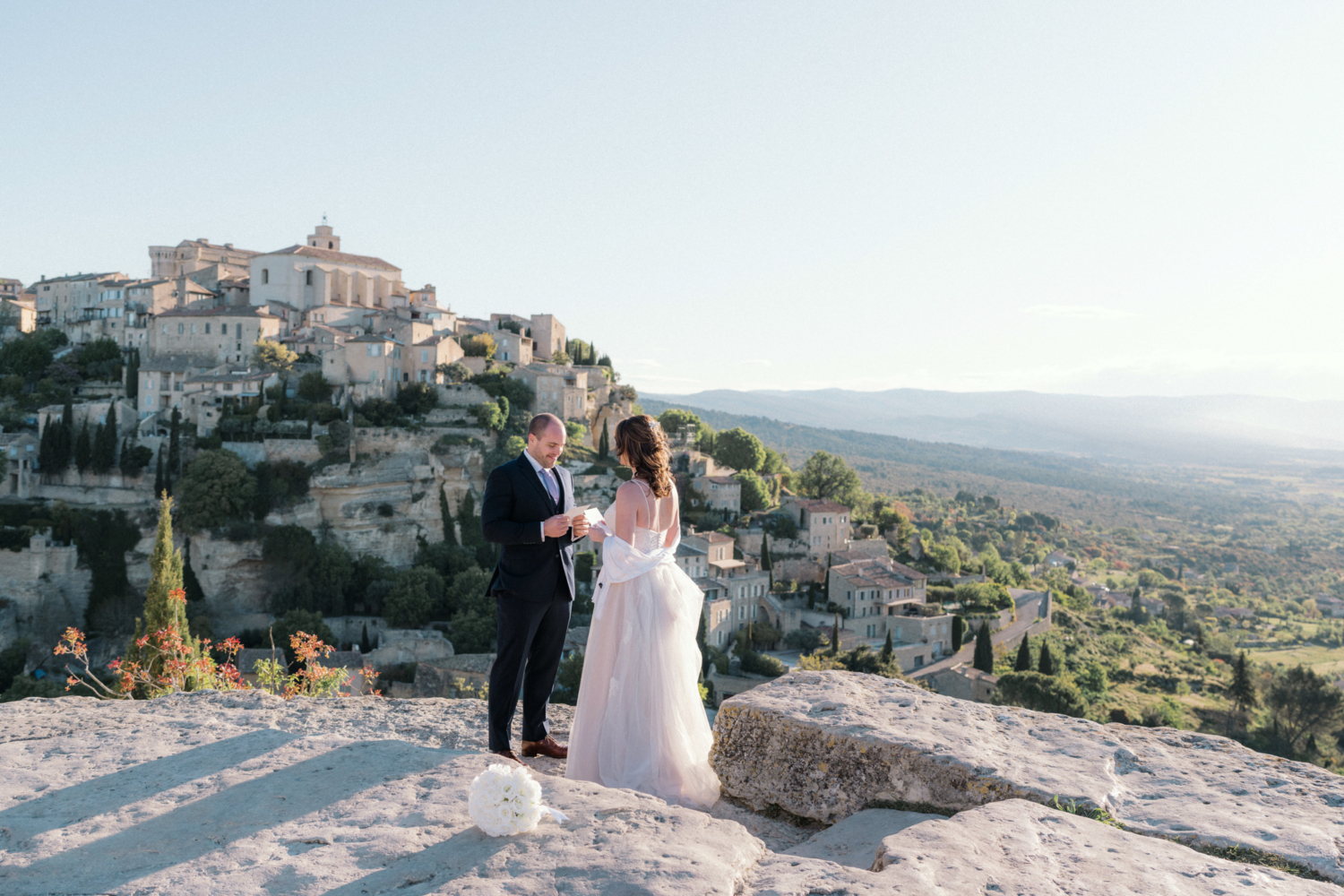 bride and groom say vows to each other in gordes