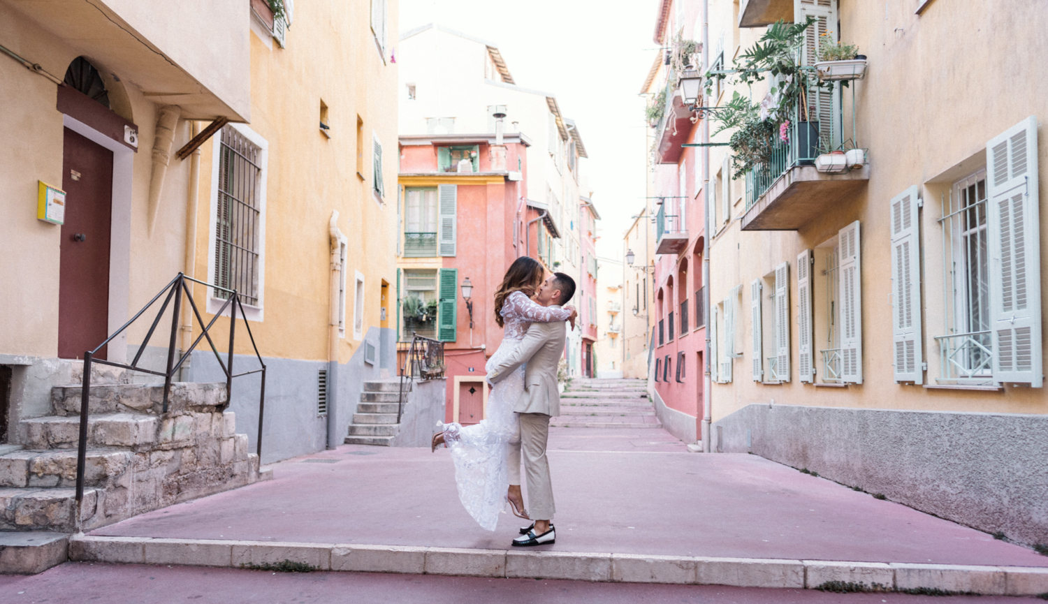 man lifts woman in air in nice france