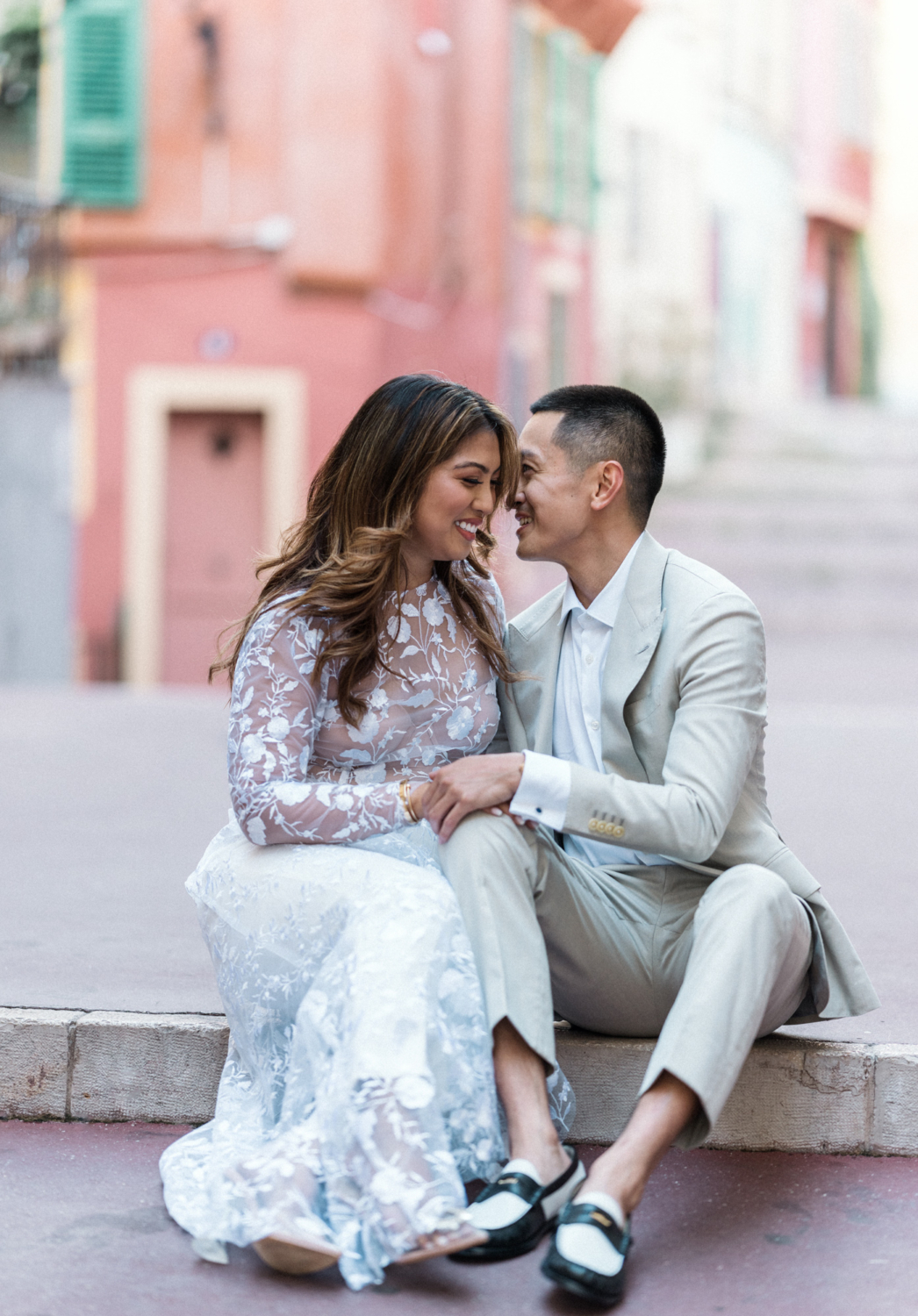 engaged couple has a laugh in old town in nice france