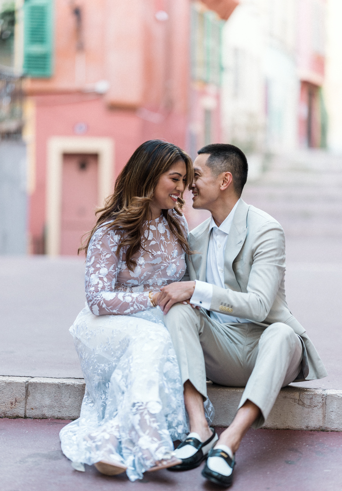 engaged couple has a laugh during Engagement Photos In Nice France