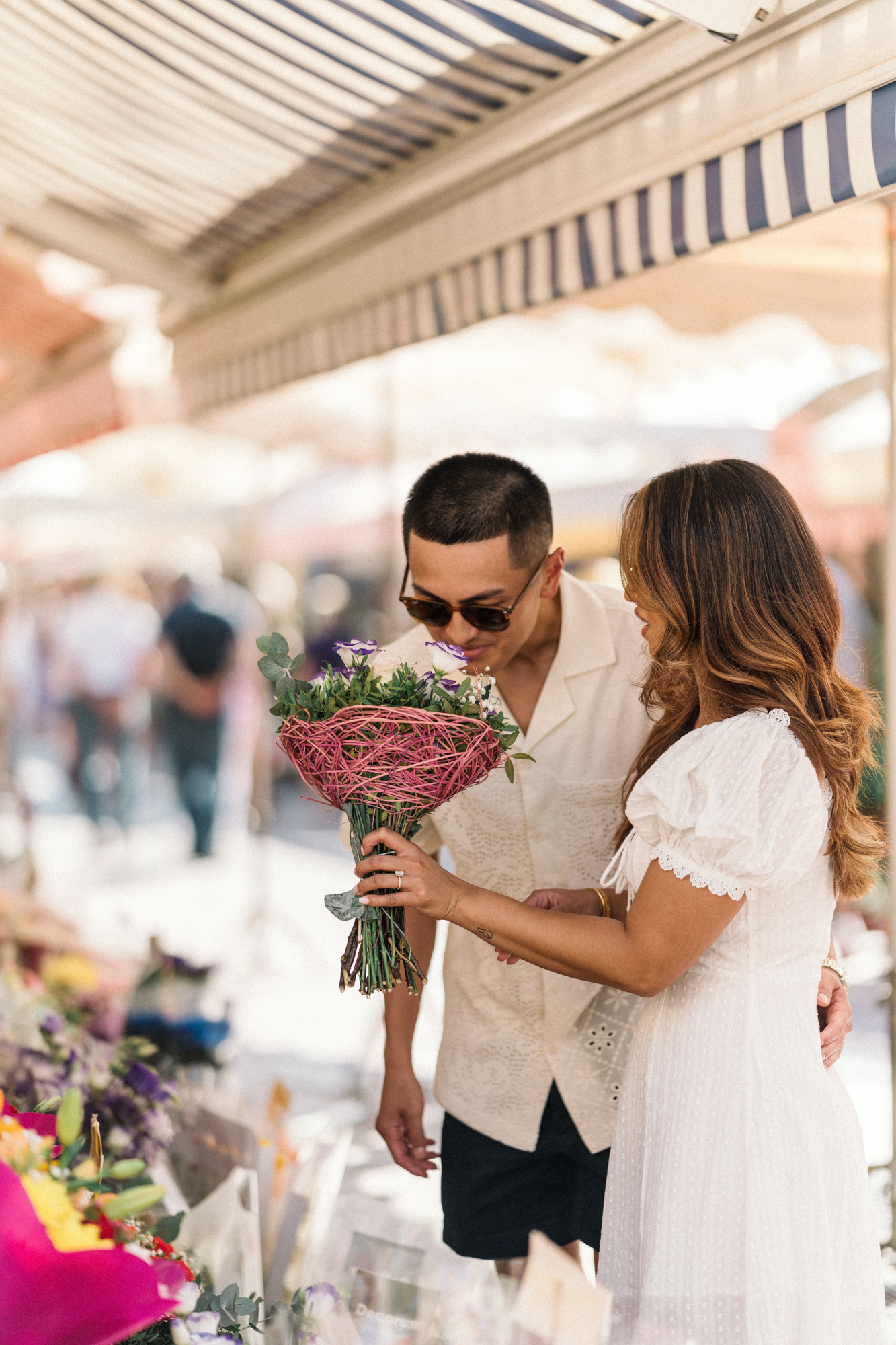 man smells bouquet in nice france