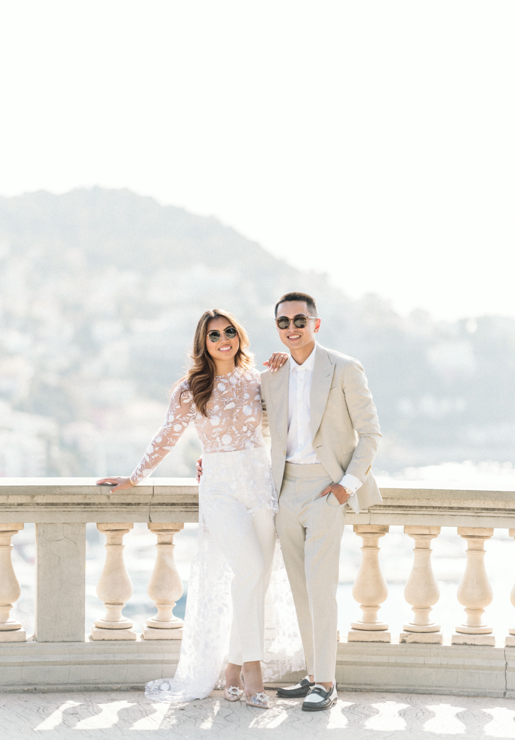 gorgeous smiling couple in white outfits in nice france