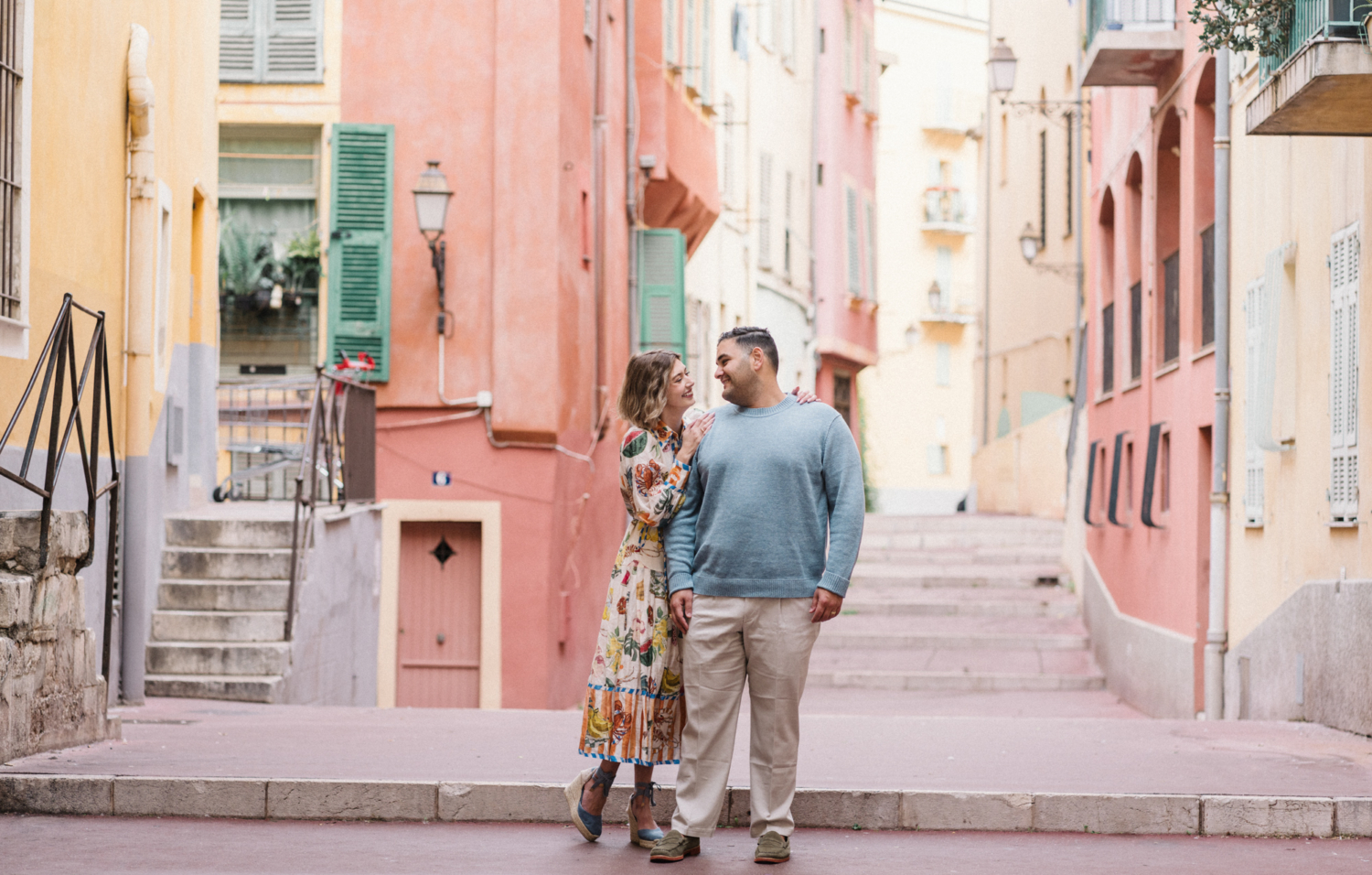 happy couple pose in old town in nice france