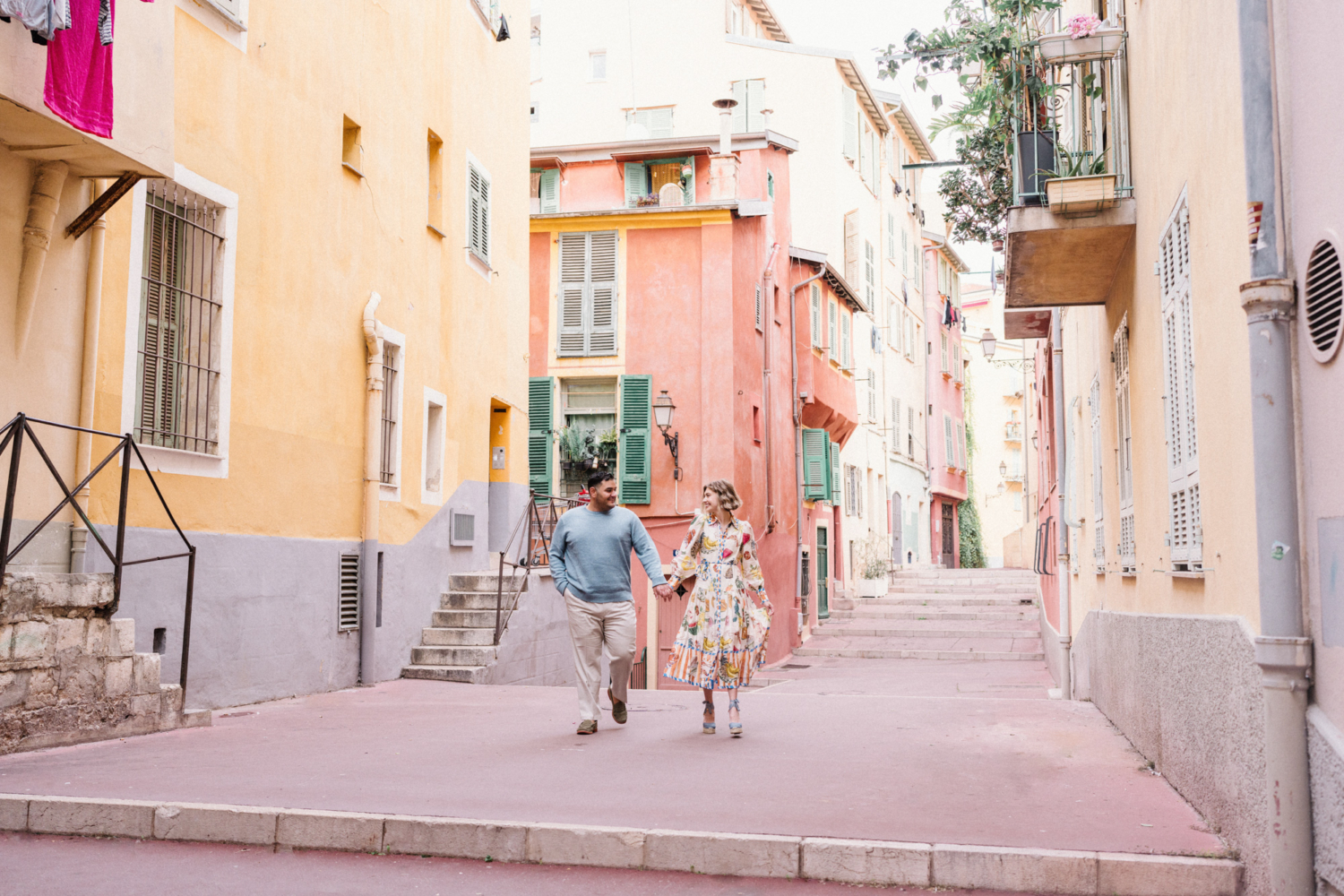 happy couple walk in old nice france