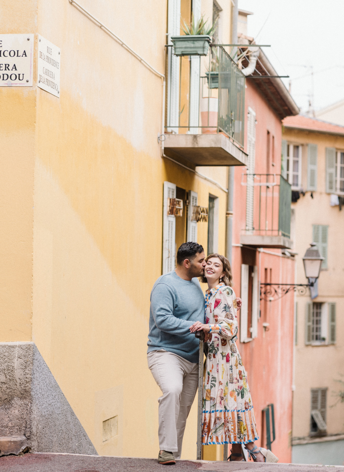 man kisses wife on cheek in nice france