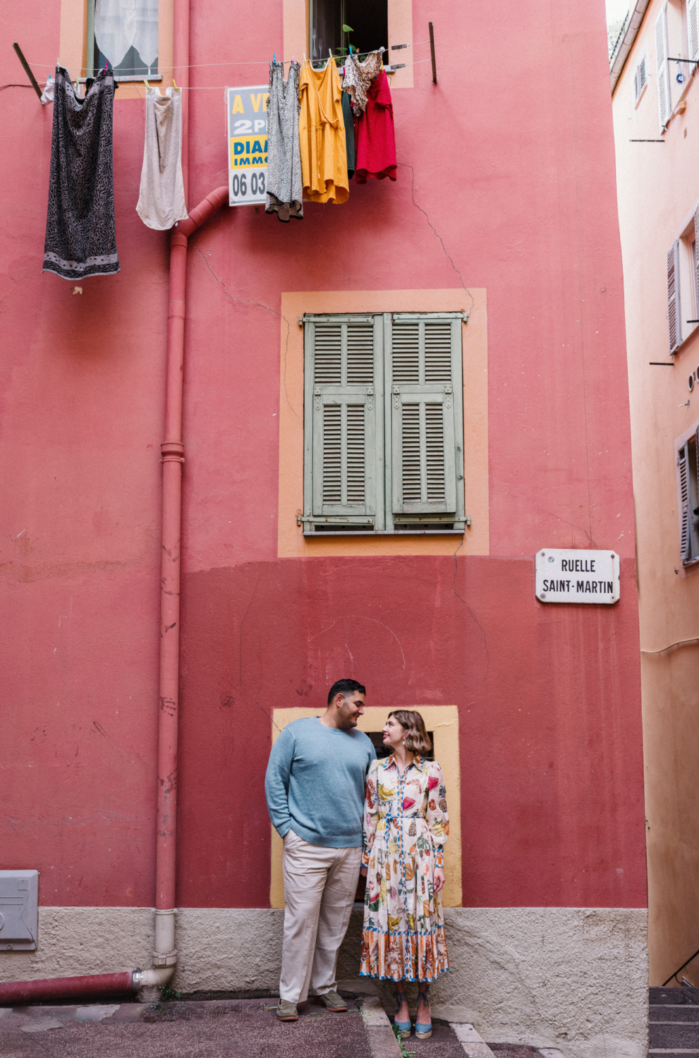 couples poses under clothesline in nice france