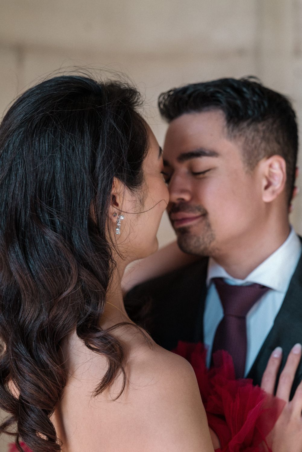 asian couple embrace in paris