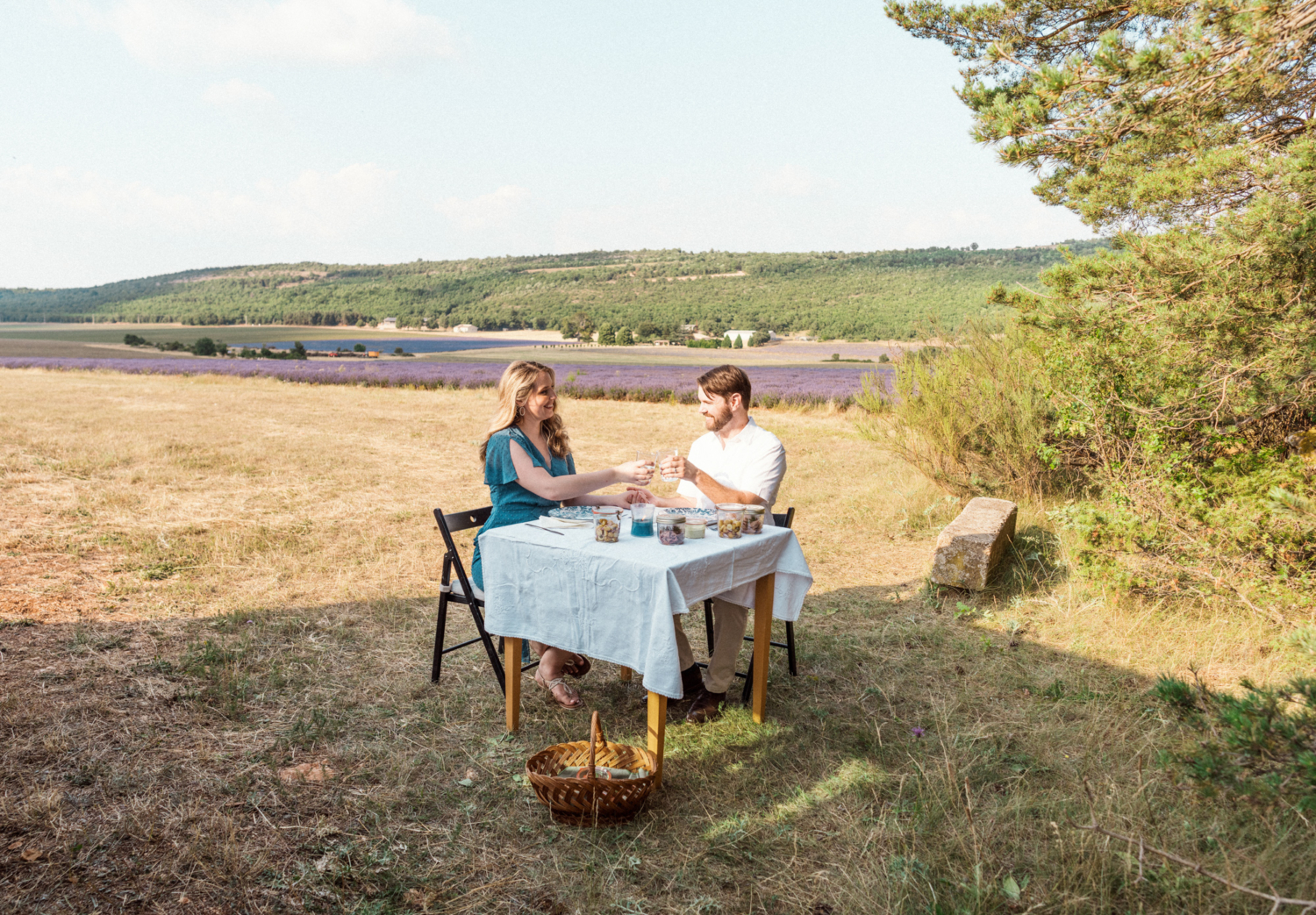 couple having a picnic dinner in the lavender fields of provence
