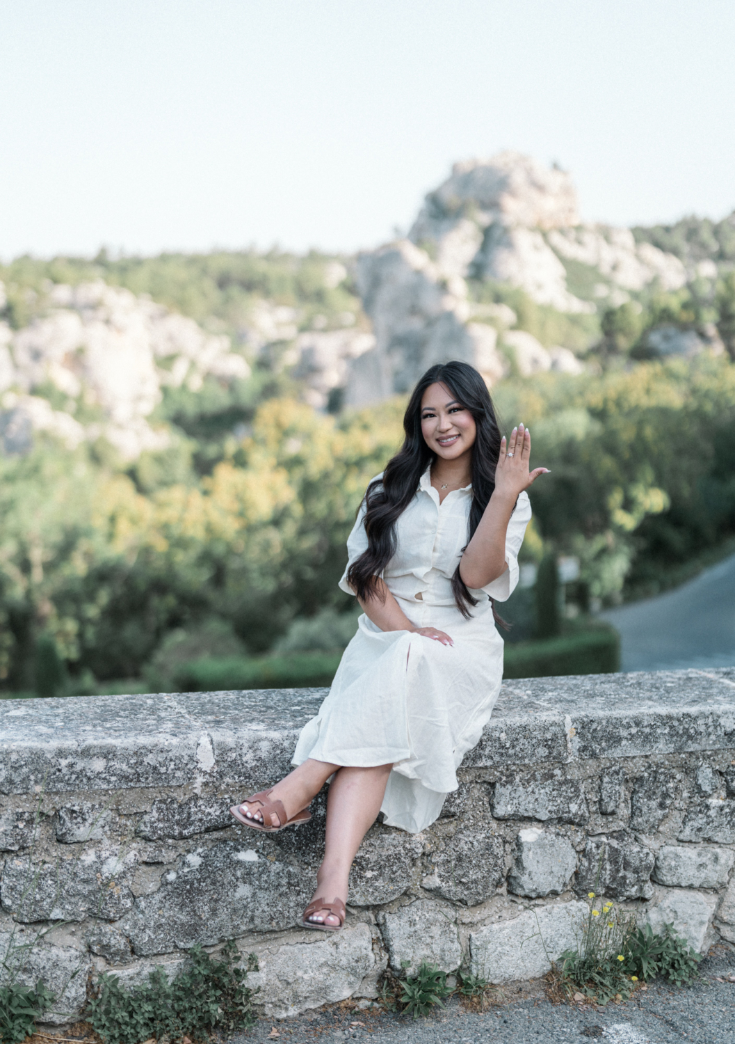 woman shows off her new engagement ring in les baux de provence