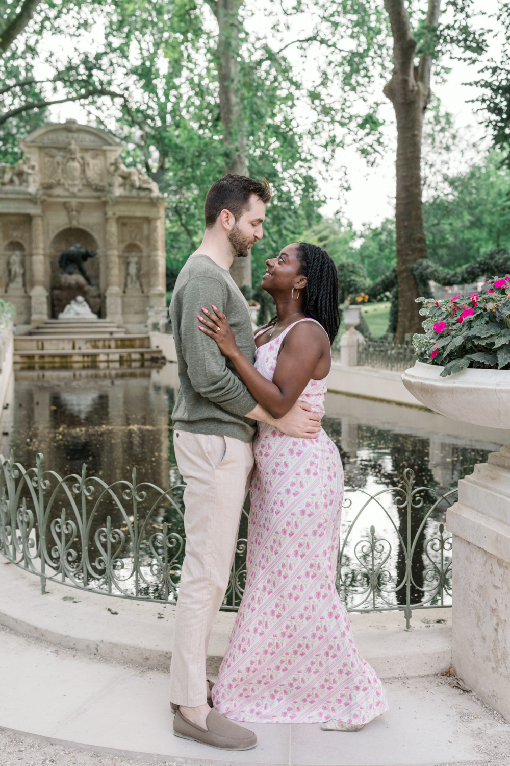 newly engaged couple pose in luxembourg gardens paris