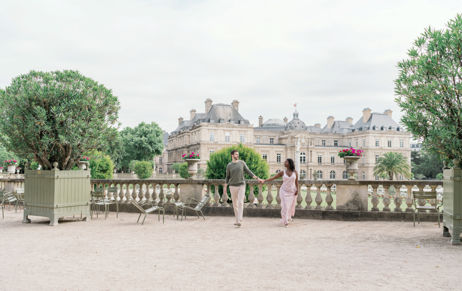 newly engaged couple walk in luxembourg gardens paris