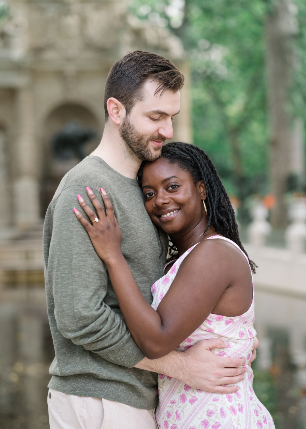 newly engaged couple pose in luxembourg gardens paris