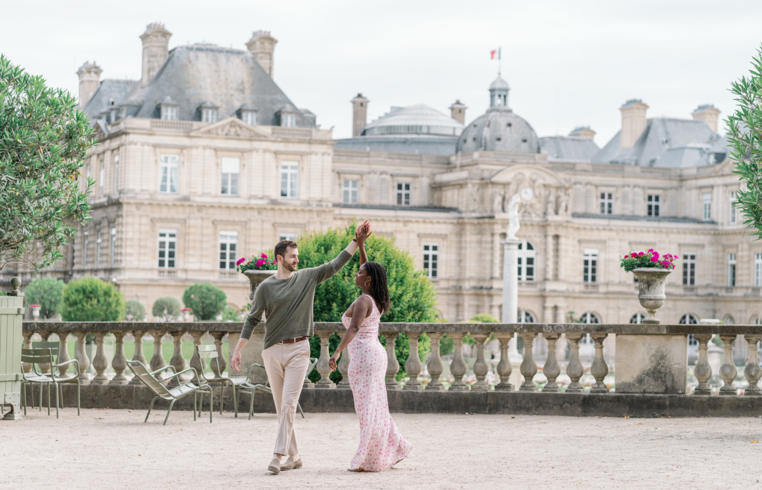 newly engaged couple dance in luxembourg gardens paris