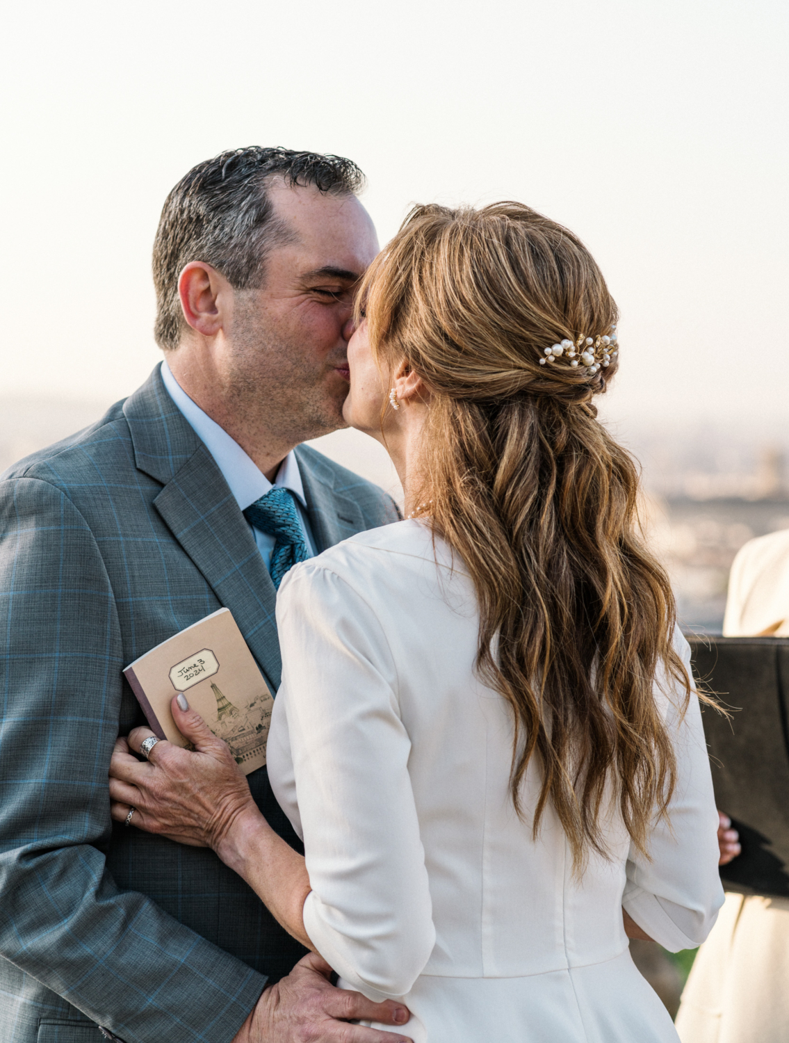 newlyweds kiss after reading their vows in paris