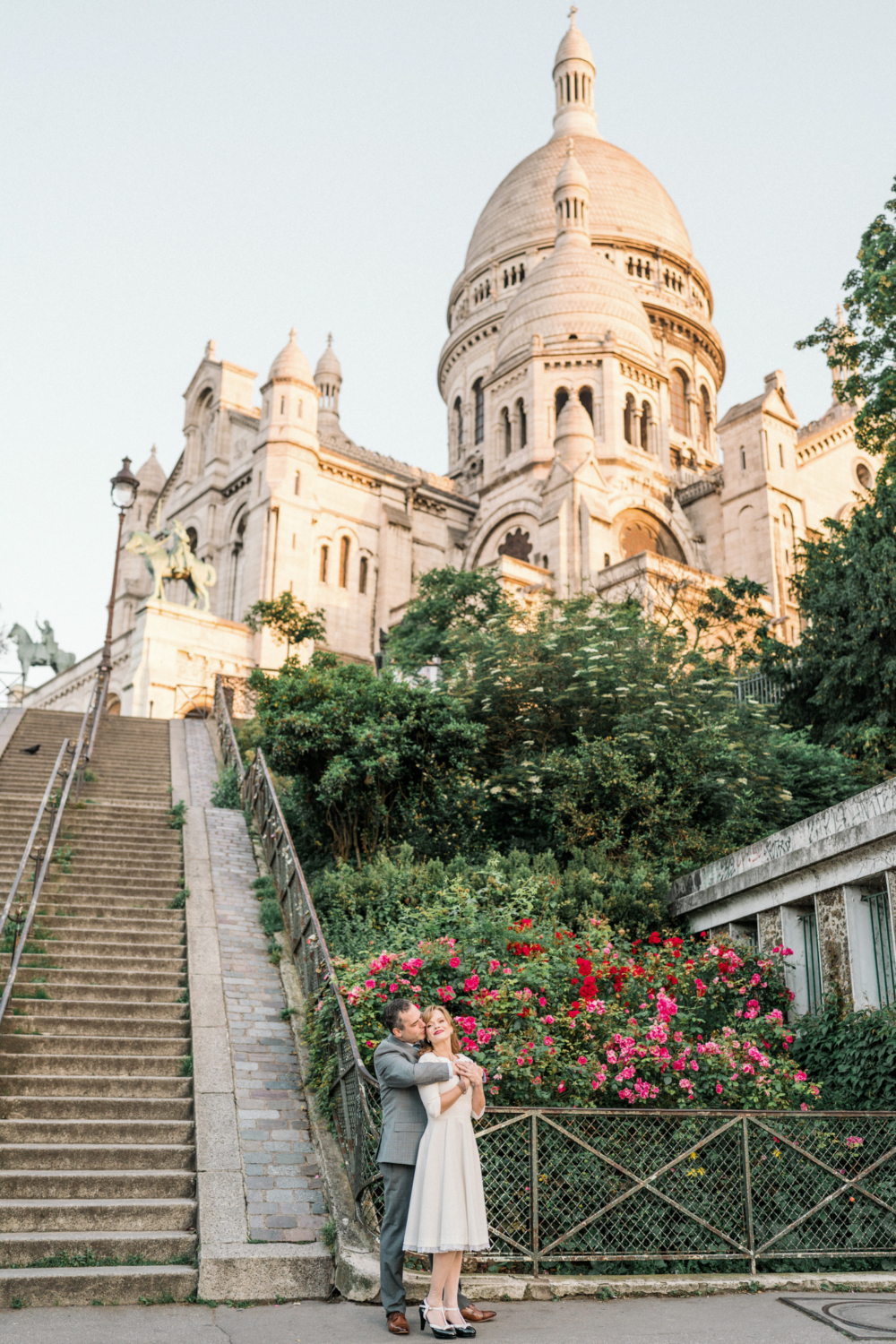 newlyweds embrace at sacre coeur basilica paris