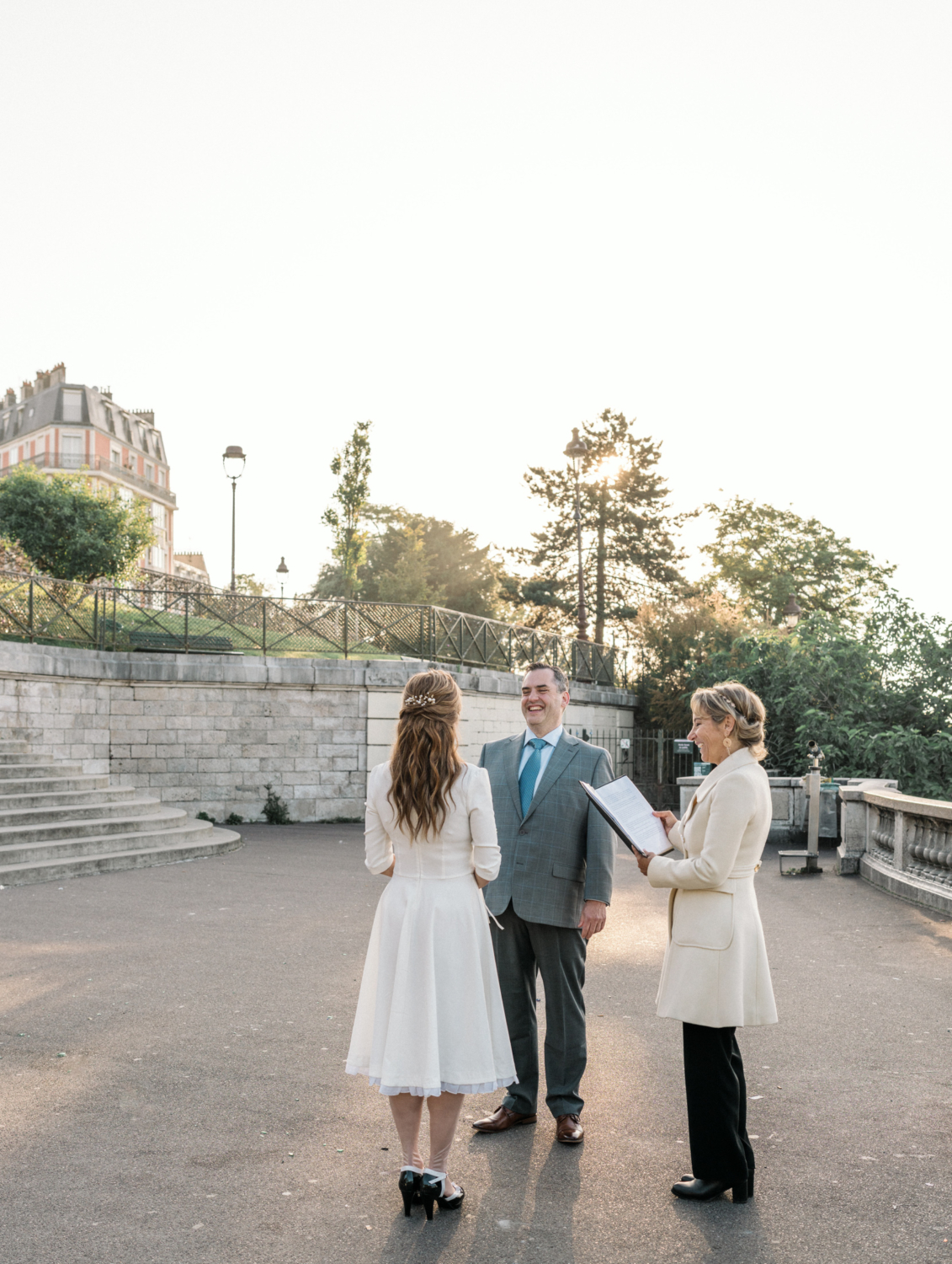 couple laughs during wedding ceremony in paris