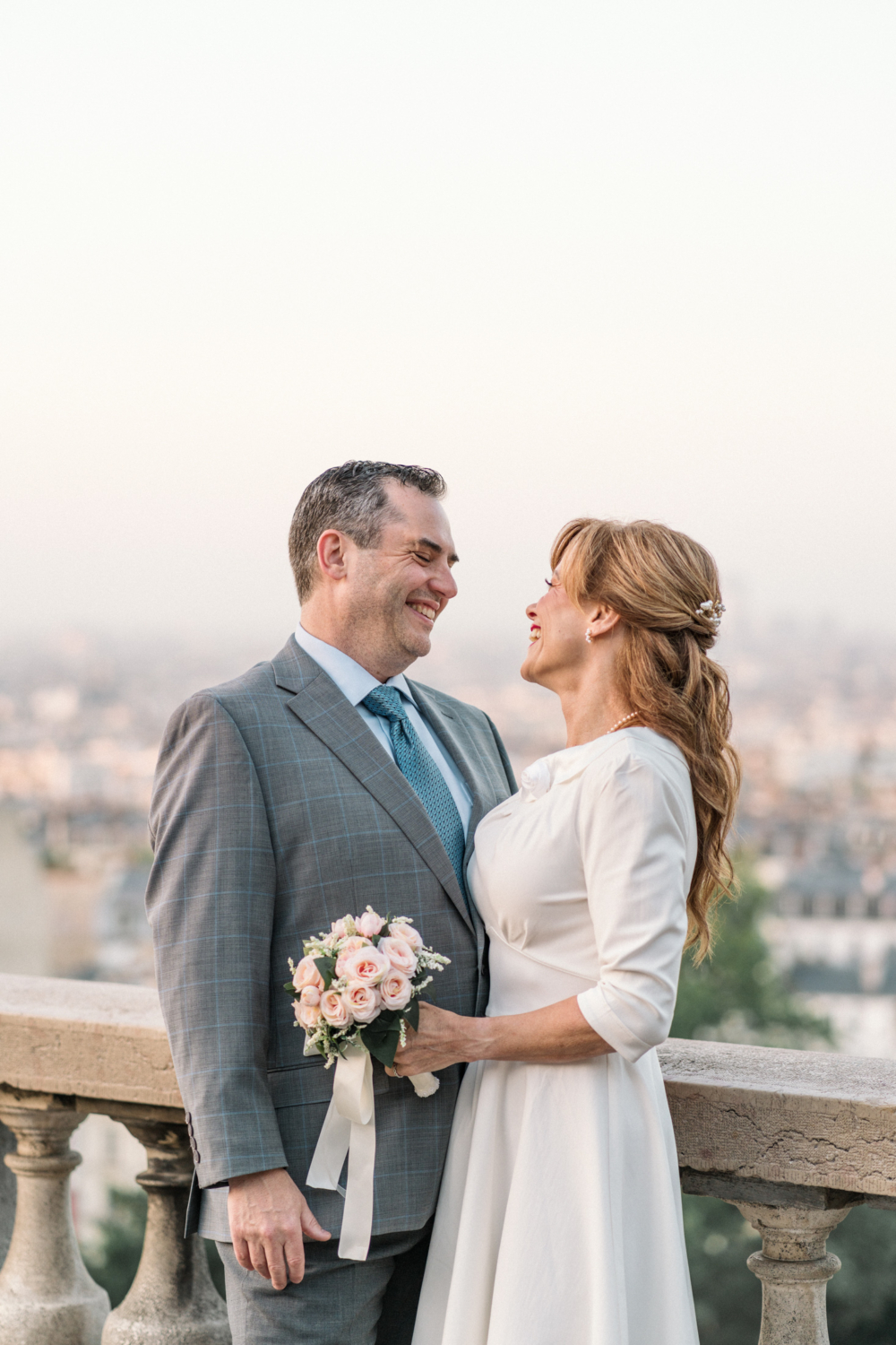 newlyweds share a laugh in paris