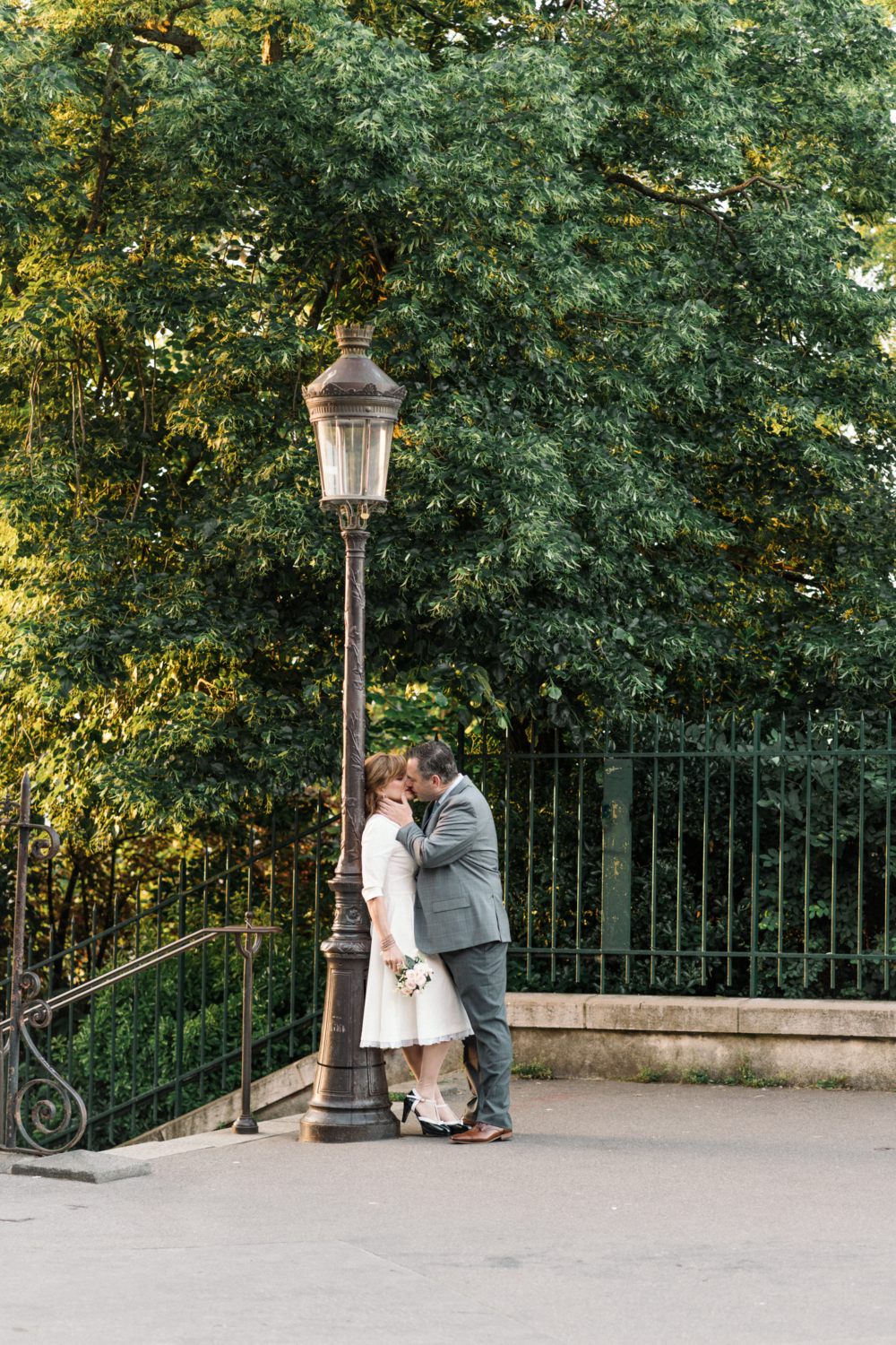 groom passionately kisses bride before wedding ceremony in paris