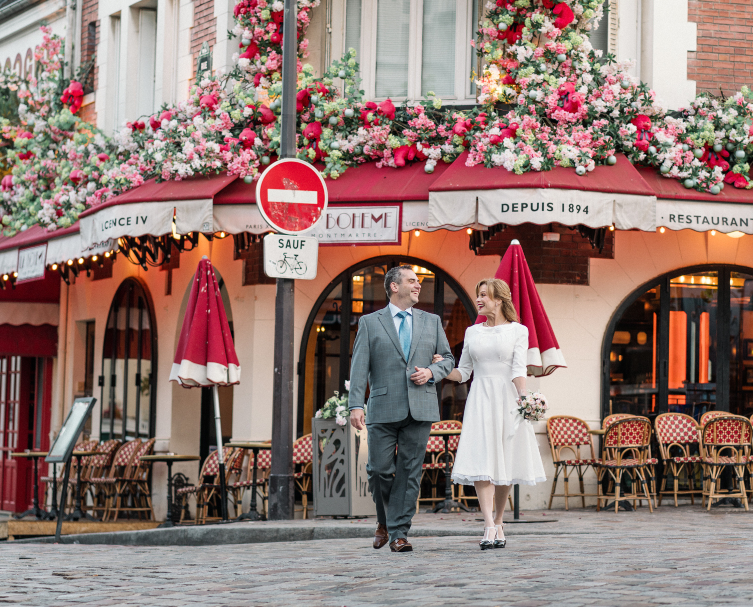 newlyweds walk and laugh in paris