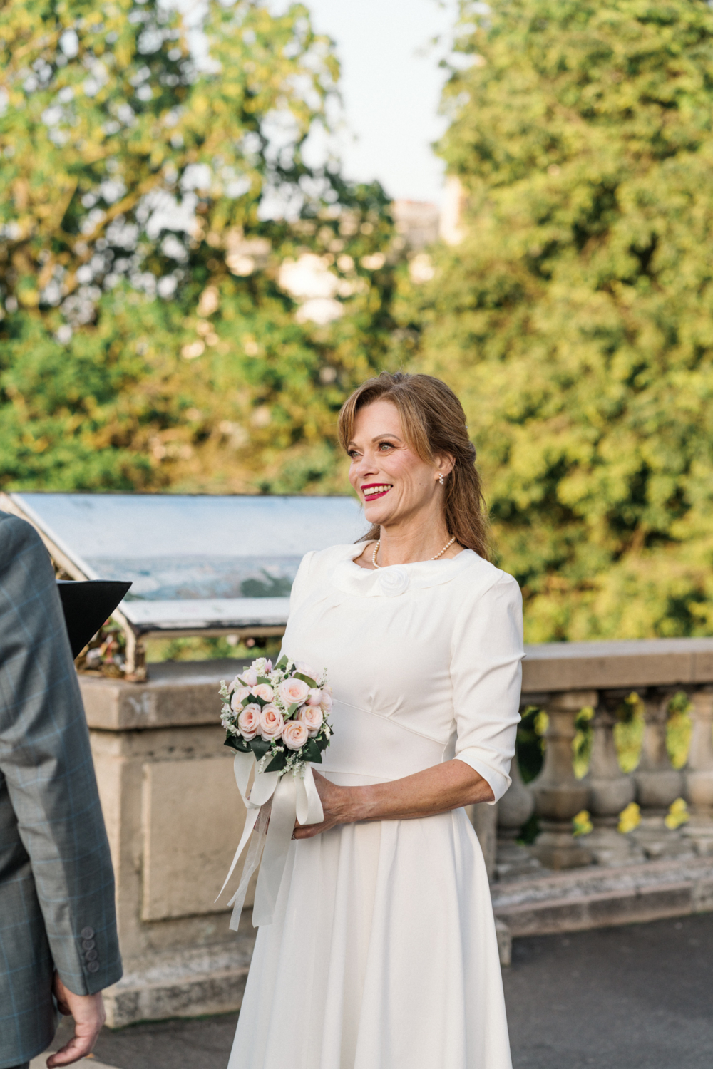 bride smiles during her wedding ceremony in paris