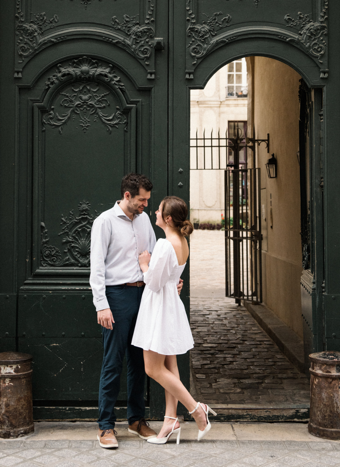 engaged couple laugh on il st louis paris