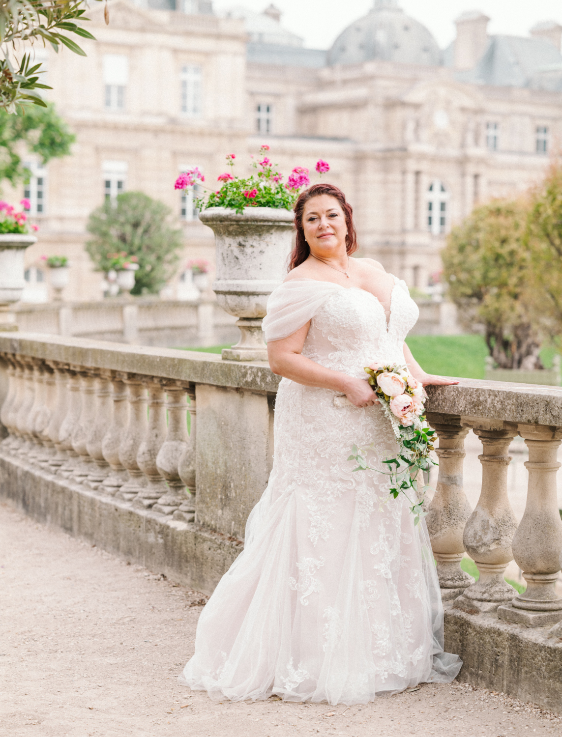 beautiful bride posing in luxembourg gardens in paris