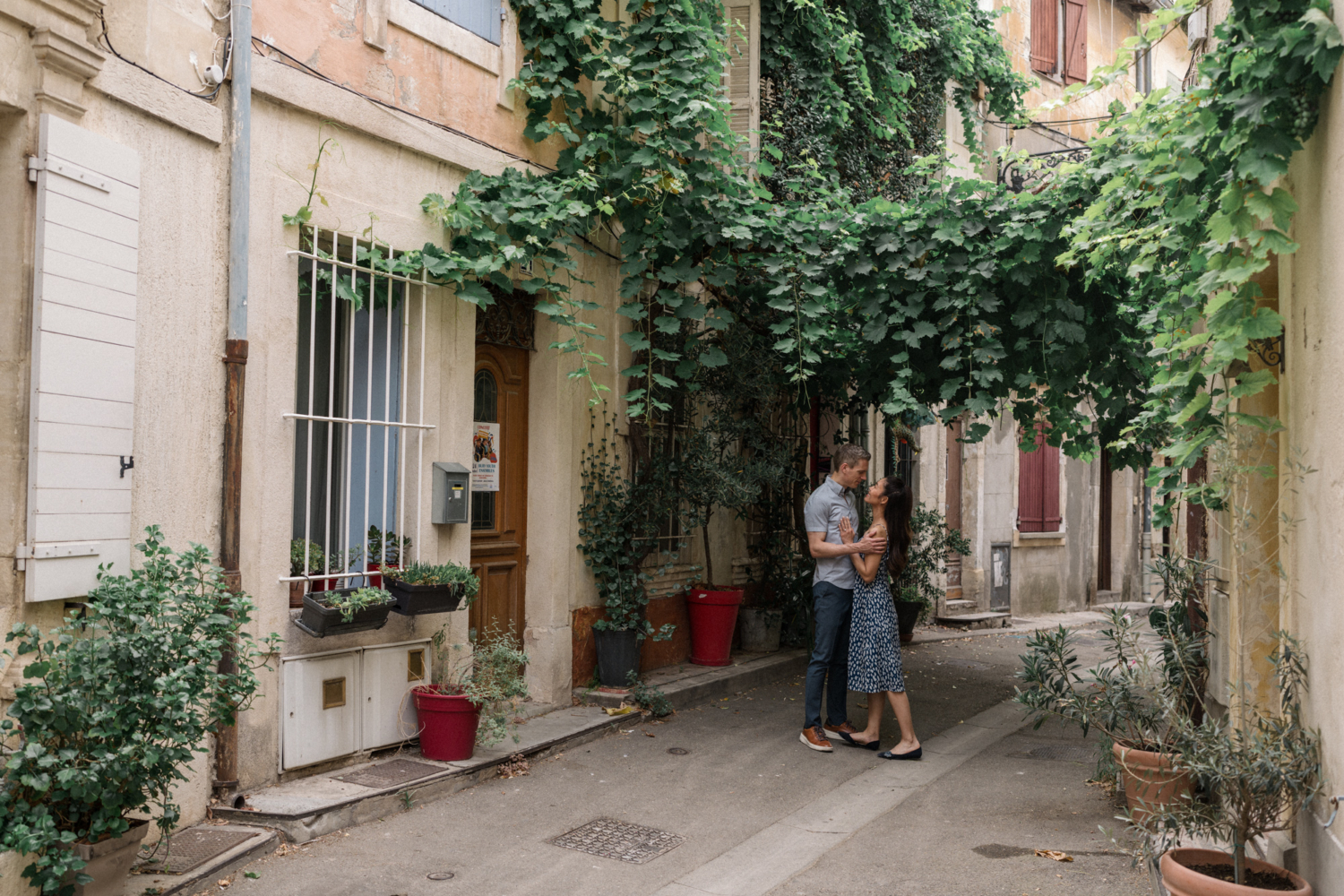 couple in love embrace in charming neighborhood in arles france