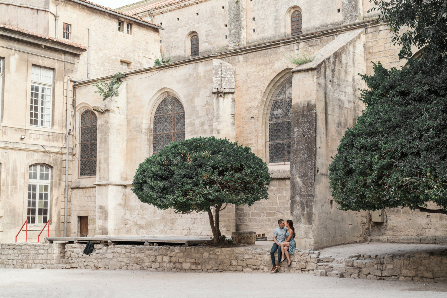 couple outside of saint trophime church in arles, france