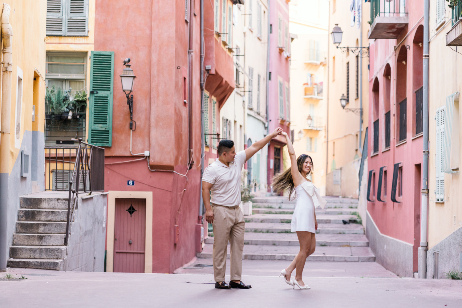 man dances with wife in nice france