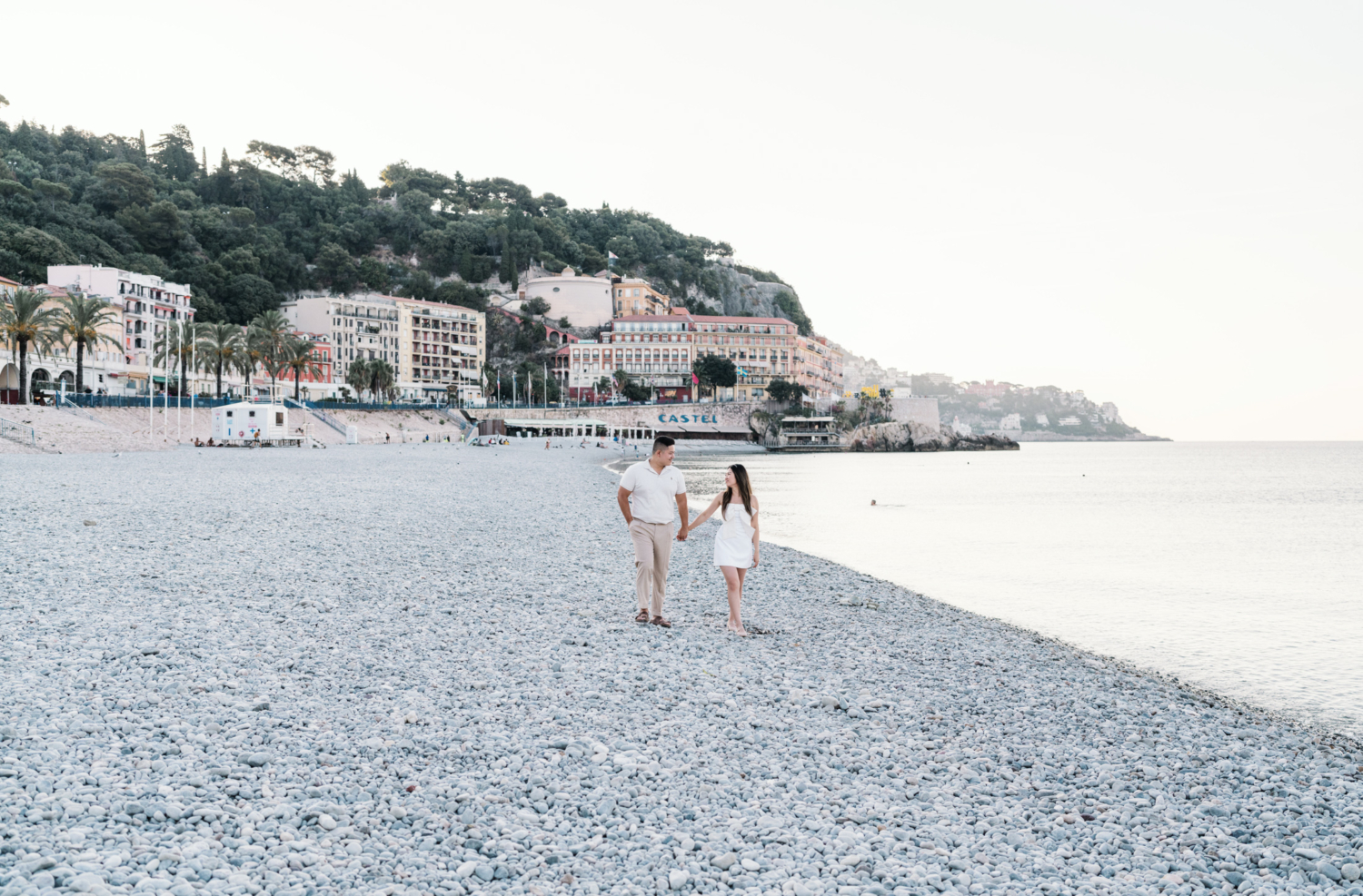 beautiful couple in love walk on the beach in nice france