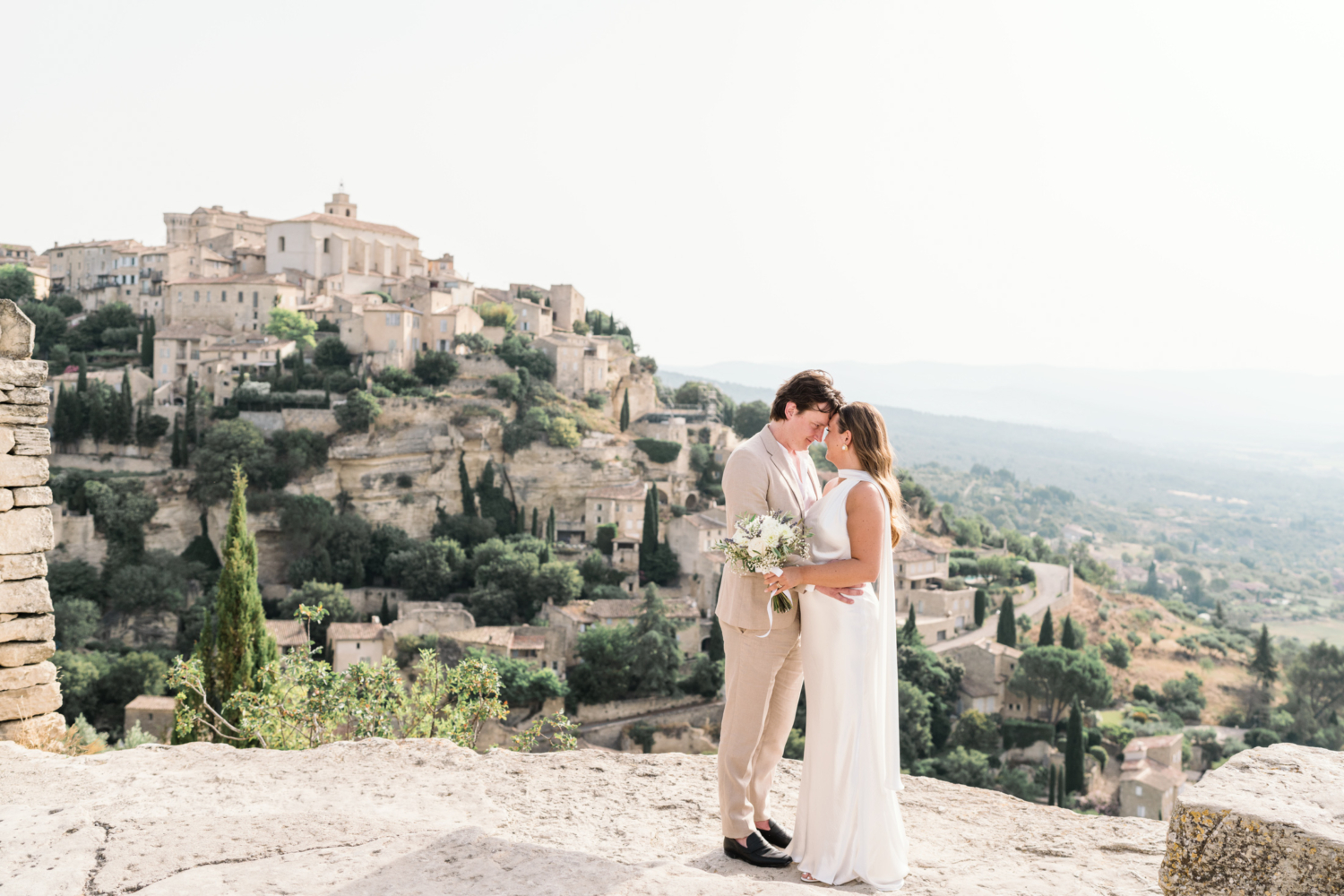 bride and groom embrace in gordes france