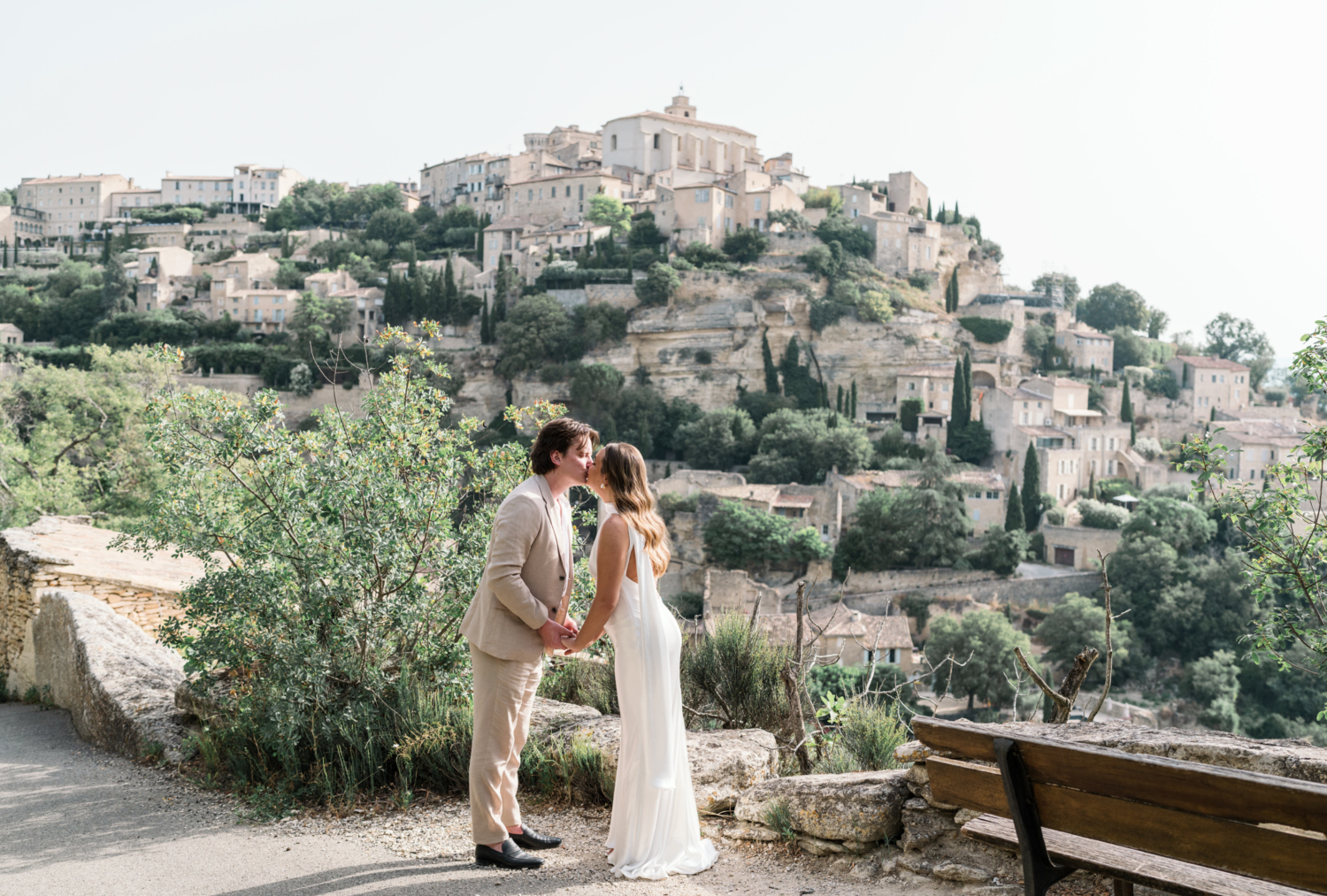 bride and groom kiss after elopement in gordes france