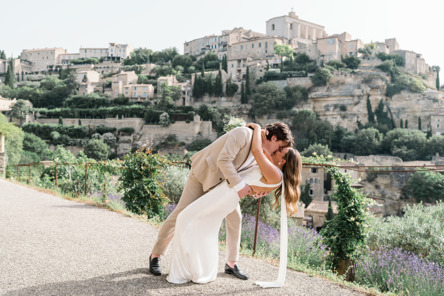 groom dips bride in gordes france