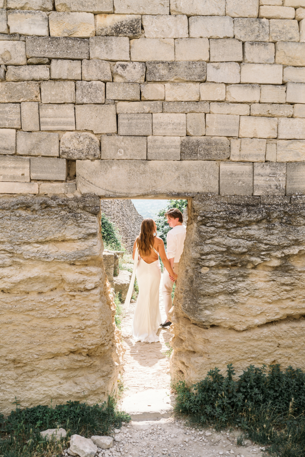 bride and groom stare lovingly at each other in lacoste france