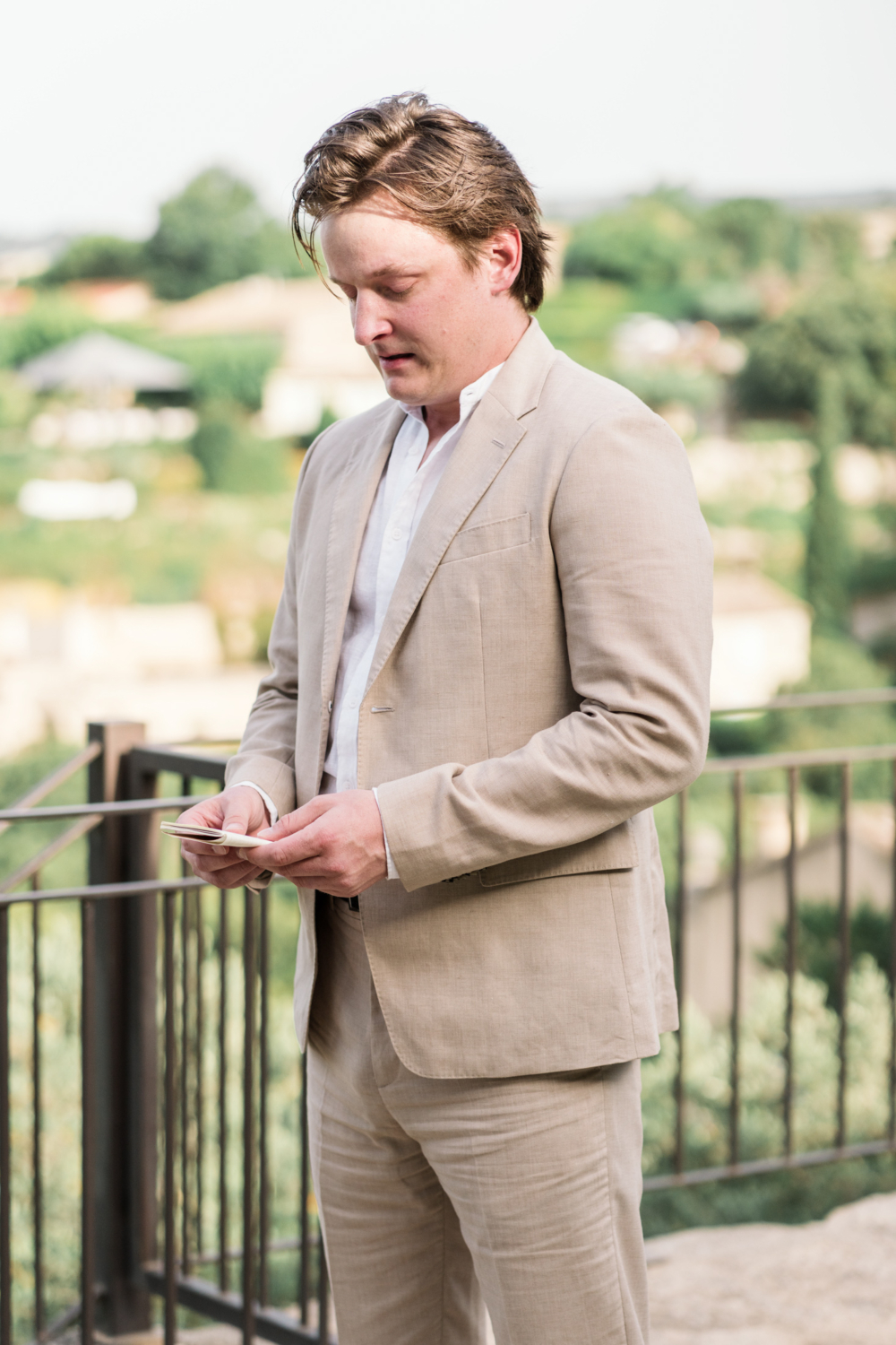 groom reads his vows during elopement ceremony in gordes france