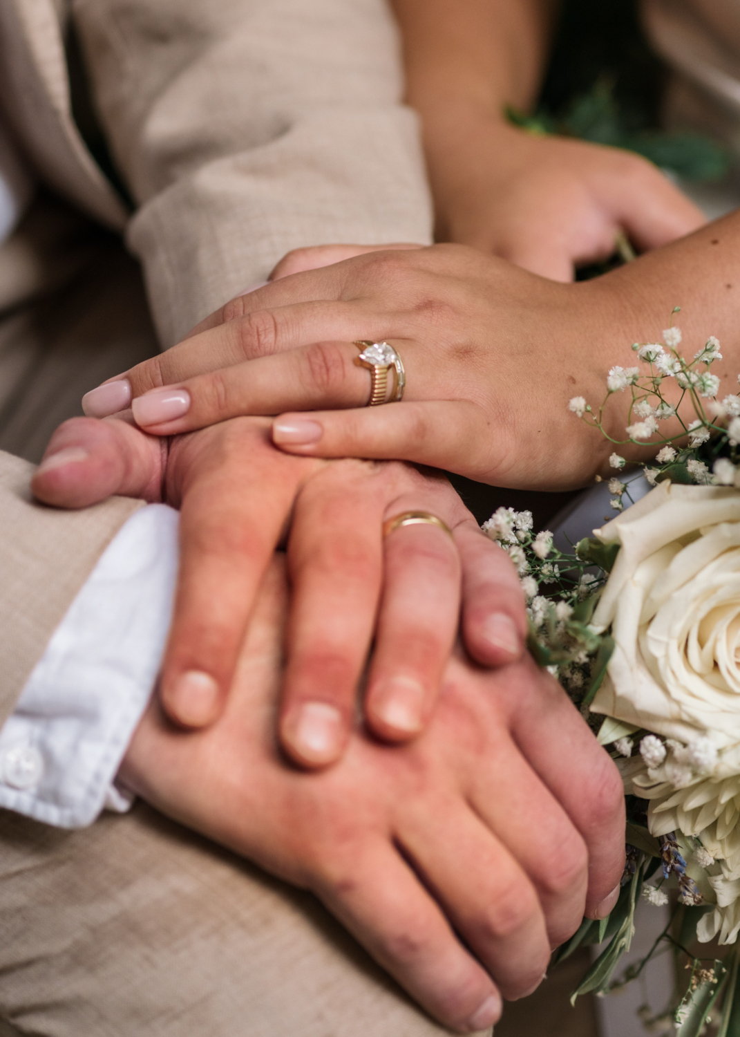 newlyweds show their wedding rings in gordes france