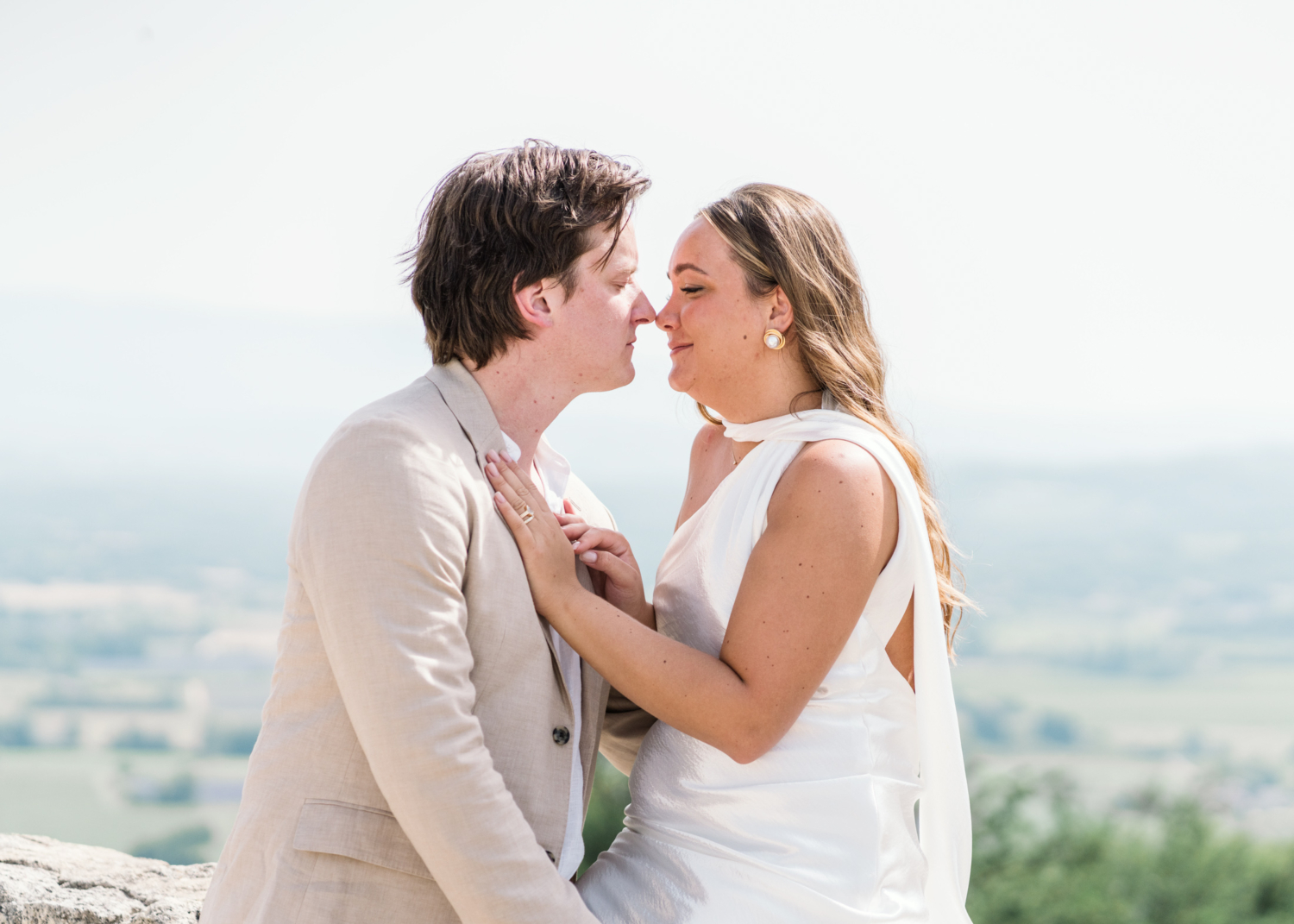 bride and groom touch noses in lacoste france