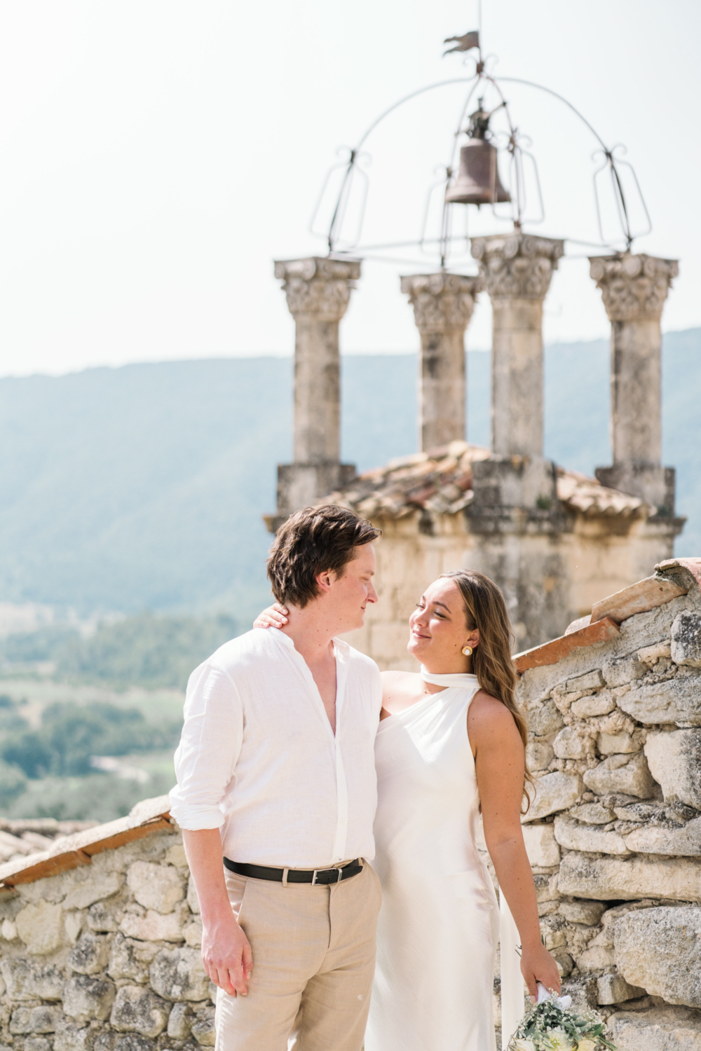 bride and groom embrace in lacoste france