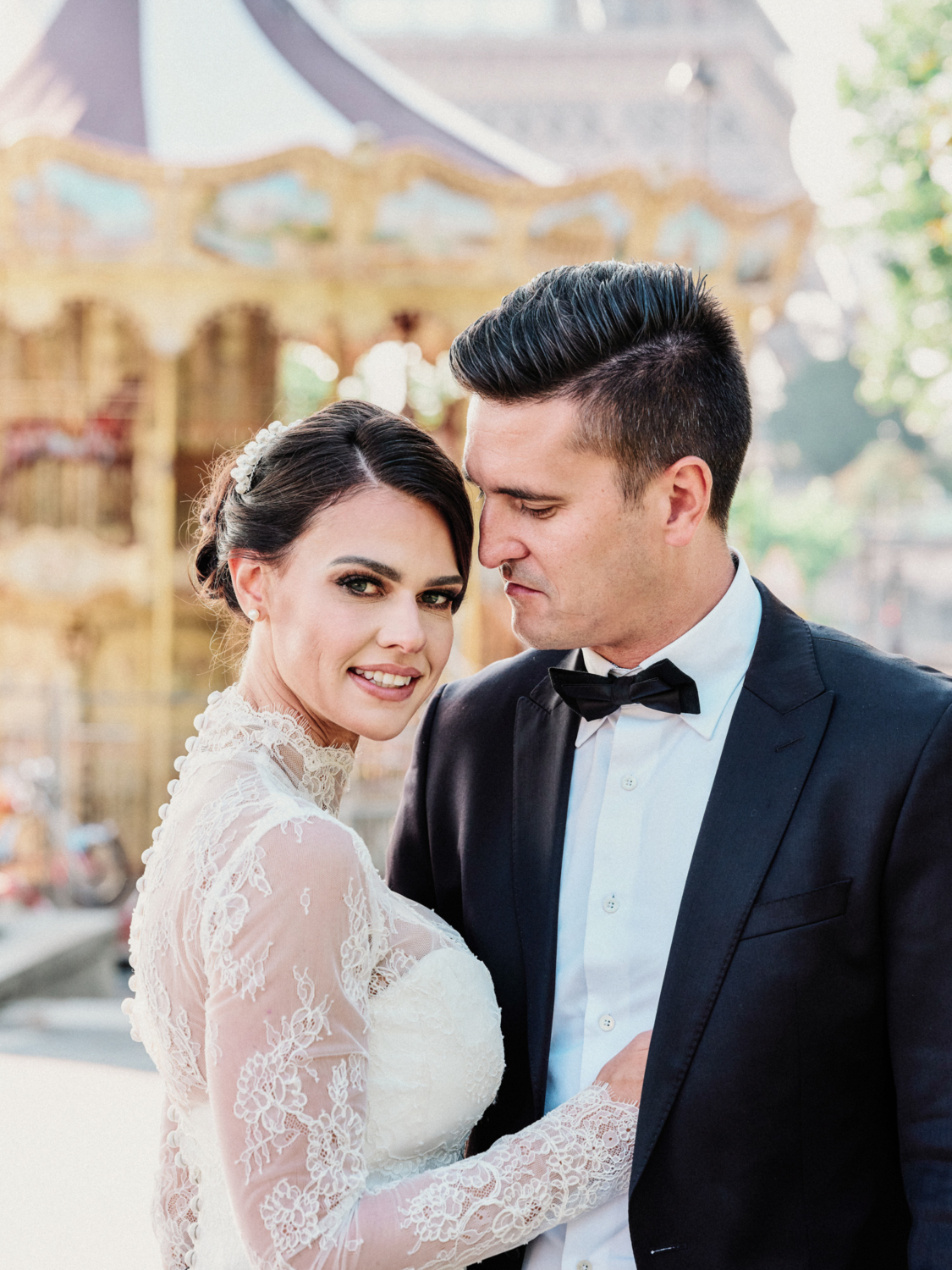 bride wraps arm around groom in paris france