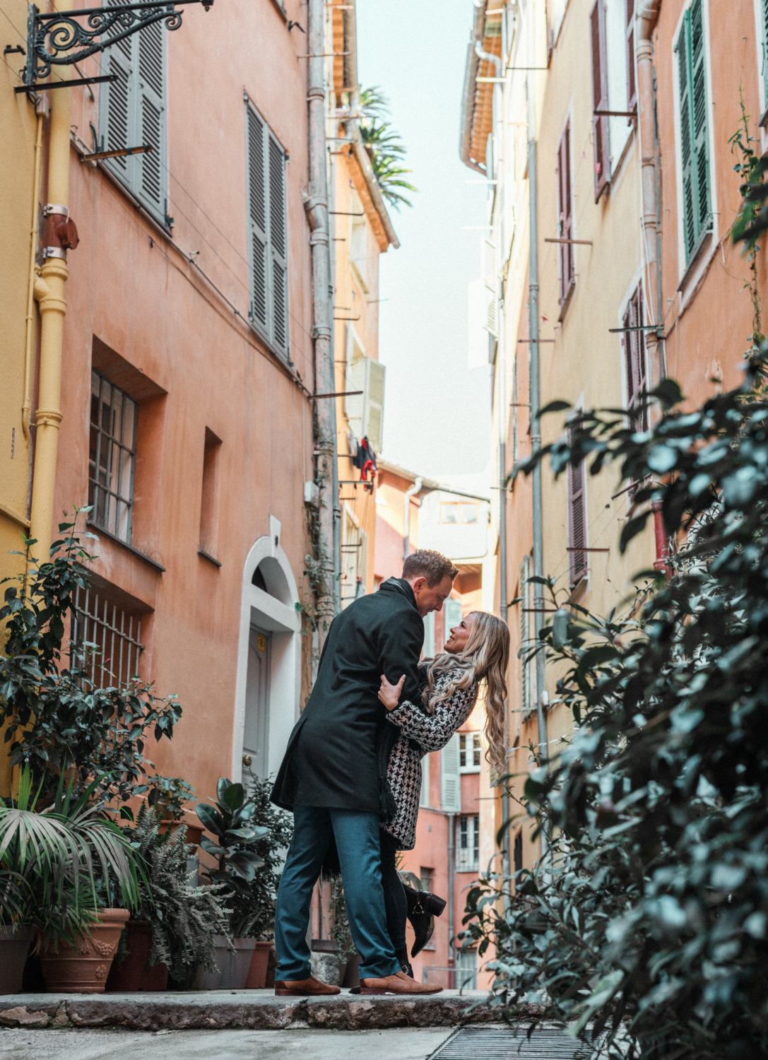 man dips woman backwards in old town nice france