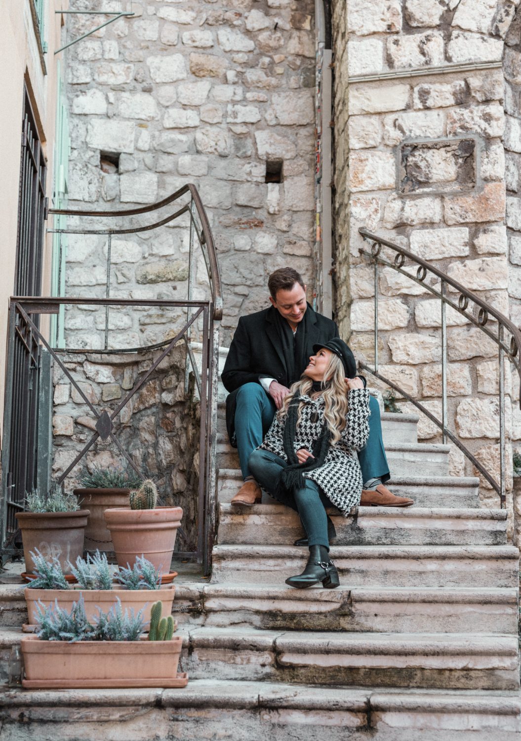 newlywed couple sit on staircase in nice france