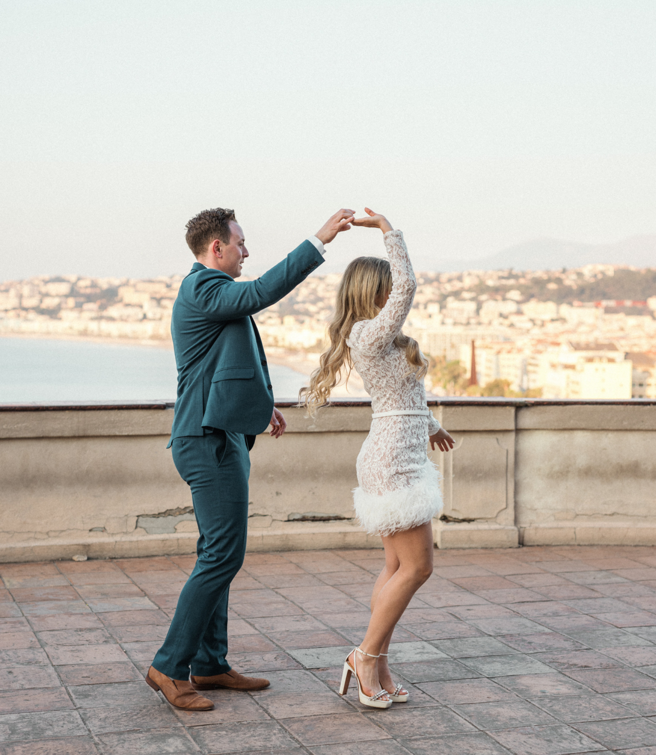 man twirls woman in a circle in nice france