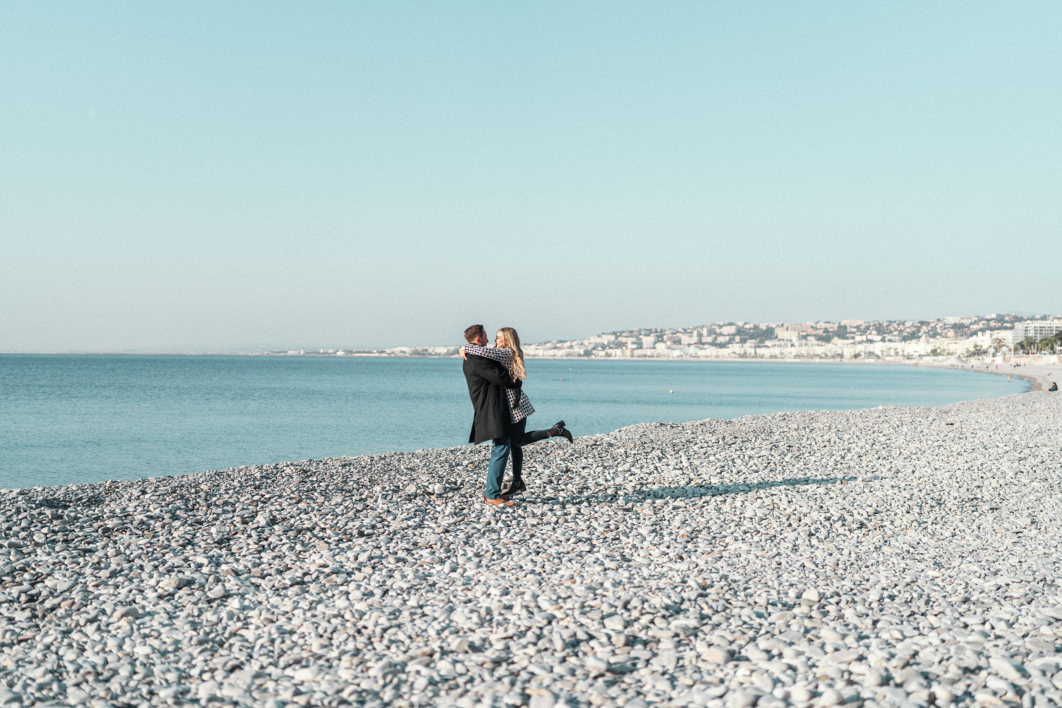 couple embracing on the beach in nice france