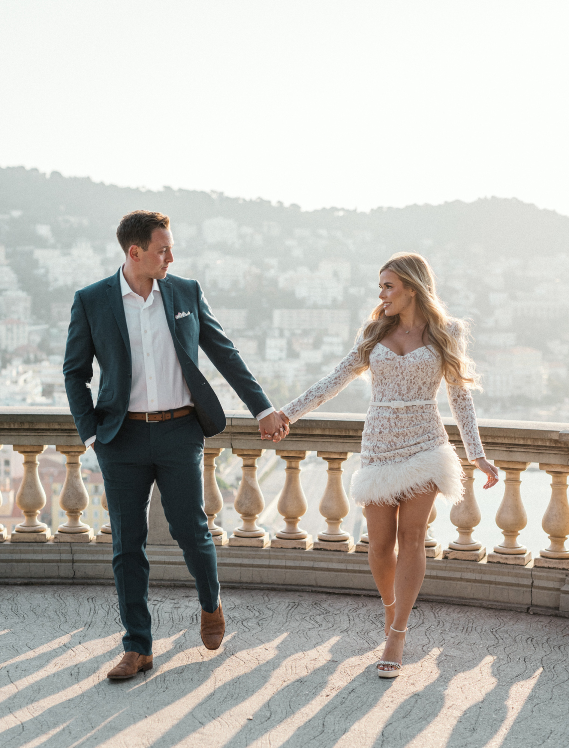 beautiful couple walk hand in hand in nice france