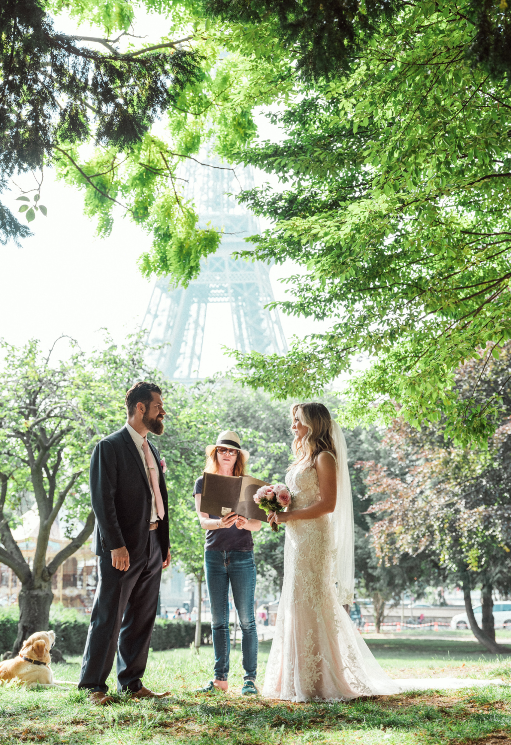 elopement ceremony in paris with dog and view of eiffel tower