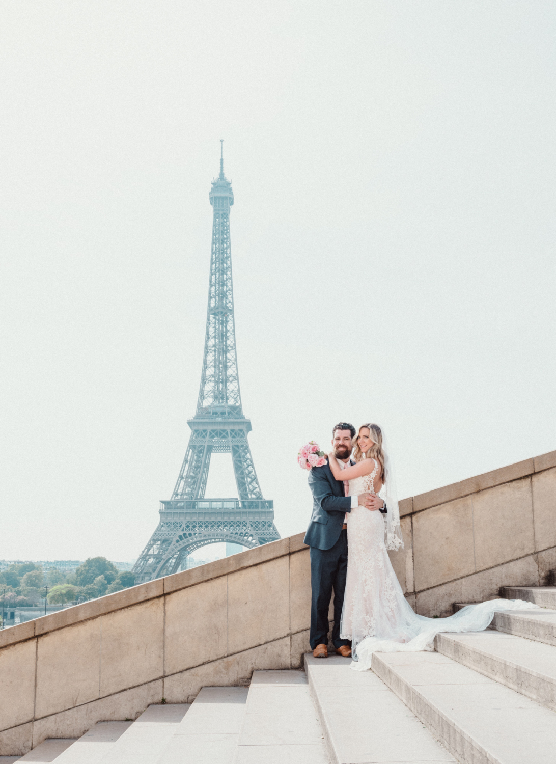 bride and groom pose at trocadero eiffel tower paris