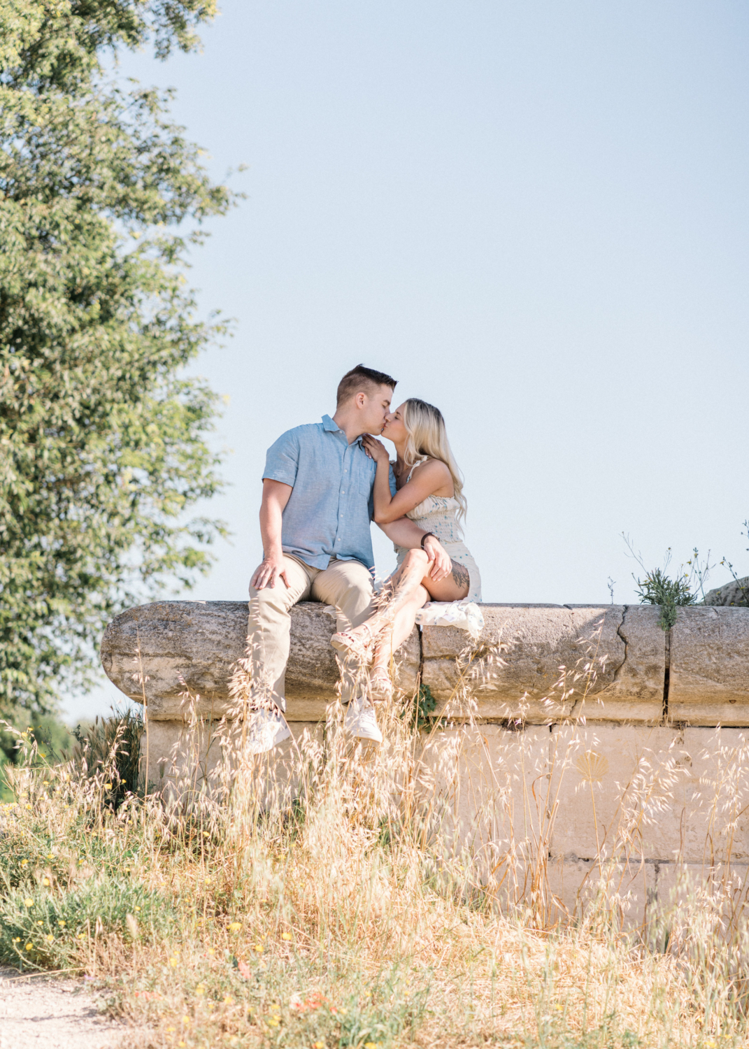 young engaged couple kiss tenderly in arles france